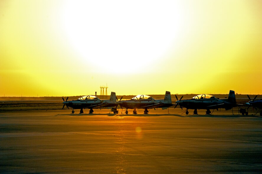 LAUGHLIN AIR FORCE BASE, Texas – Three T-6 Texan II aircraft wait as the sun comes up to be prepped for the day’s operations begin here Aug. 25. (U.S. Air Force photo/Senior Airman Scott Saldukas) 