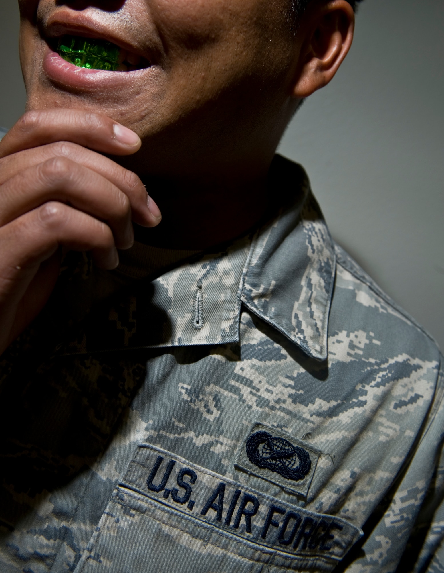 U.S. Air Force Airman shows off his ornamented teeth Aug. 23, 2011, at Nellis Air Force Base, Nev. The new Air Force Instruction 36-2903, which was revised July 18, 2011, states Airmen are not allowed to have any type of dental ornamentation unless it is for dental/medical necessity. The photo is staged and intended to provide a visual example of improper standards due to recent updates to AFI 36-2903, Dress and Personal Appearance of Air Force Personnel. (U.S. Air Force photo by Airman 1st Class Daniel Hughes/Released)
