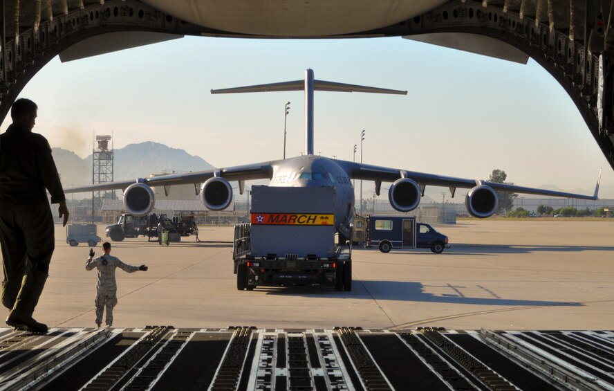 March aircrew and aerial port members load a maintenance pallet onto a C-17 Globemaster III, Wednesday, August 24, 2011, in preparation for a mission to pick up cargo in Mongolia for NASA.  An Air Force Reserve crew from March Air Reserve Base, Calif., flew a C-141 Starlifter into the landlocked nation in July 1991 and were the first U.S. military aircraft to land there.  (U.S. Air Force photo/Master Sgt. Linda Welz)