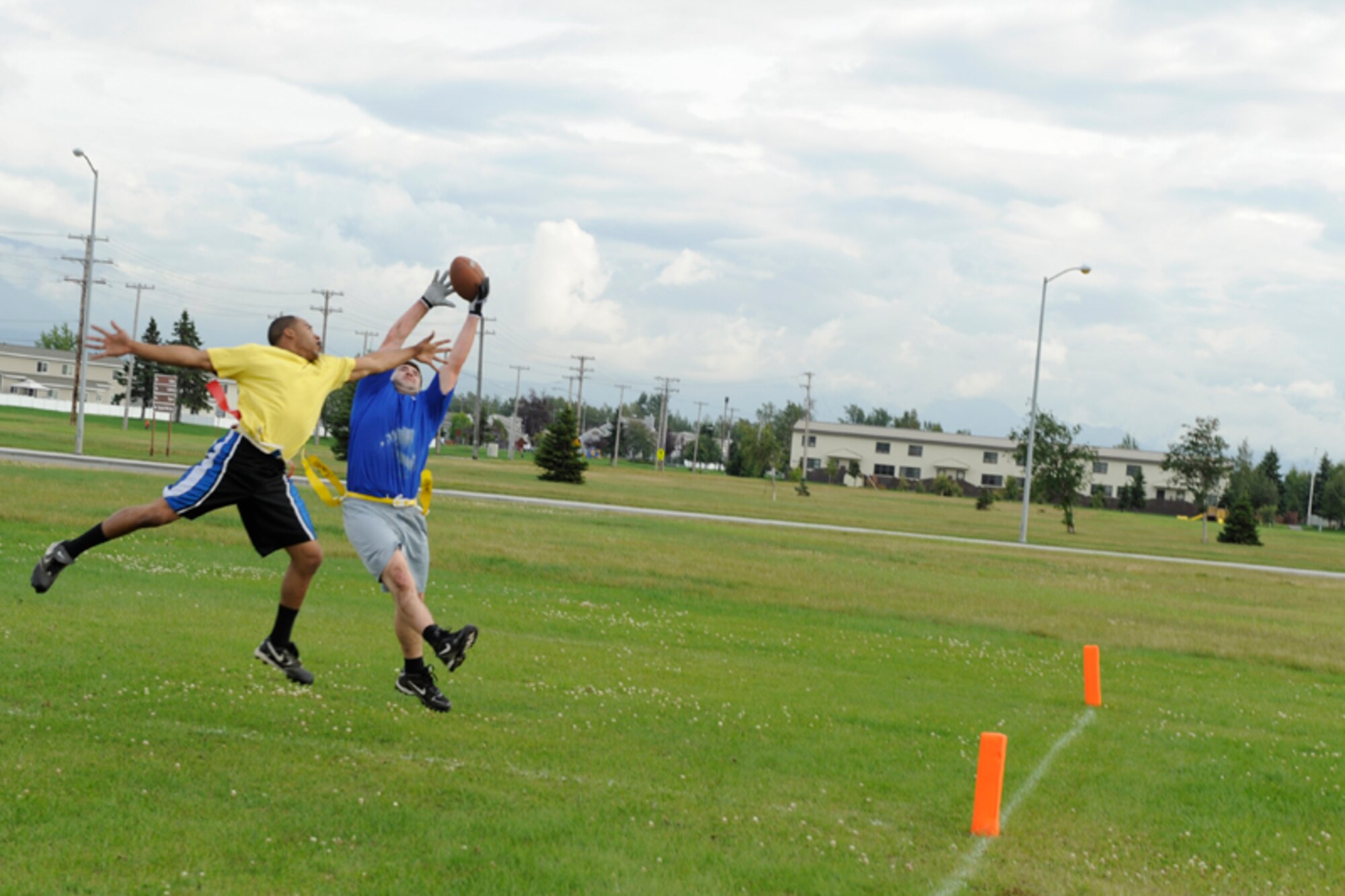 Airmen from the 673d Medical Group (blue shirts), lost to the 3rd Maintenance Squadron, 20-6 on Joint Base Elmendorf-RIchardson’s flag football field Monday. Autumn is approaching and the intramural flag football season is now on, with unit teams from around JBER battling it out at the Buckner Physical Fitness Center field and on the corner of Arctic Warrior Drive and Fairchild Avenue after duty hours. (U.S. Air Force photo/Steven White)