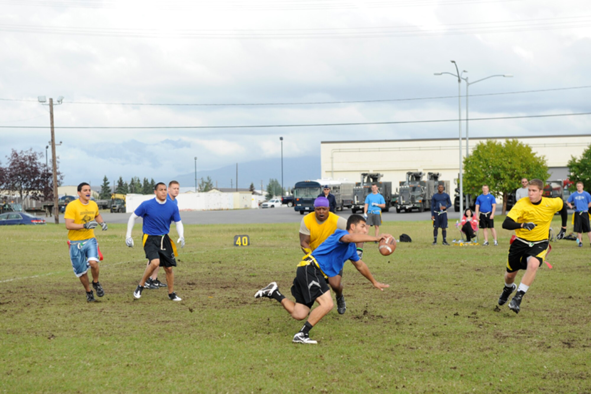 Airmen from the 673d Medical Group (blue shirts), lost to the 3rd Maintenance Squadron, 20-6 on Joint Base Elmendorf-RIchardson’s flag football field Monday. Autumn is approaching and the intramural flag football season is now on, with unit teams from around JBER battling it out at the Buckner Physical Fitness Center field and on the corner of Arctic Warrior Drive and Fairchild Avenue after duty hours. (U.S. Air Force photo/Steven White)