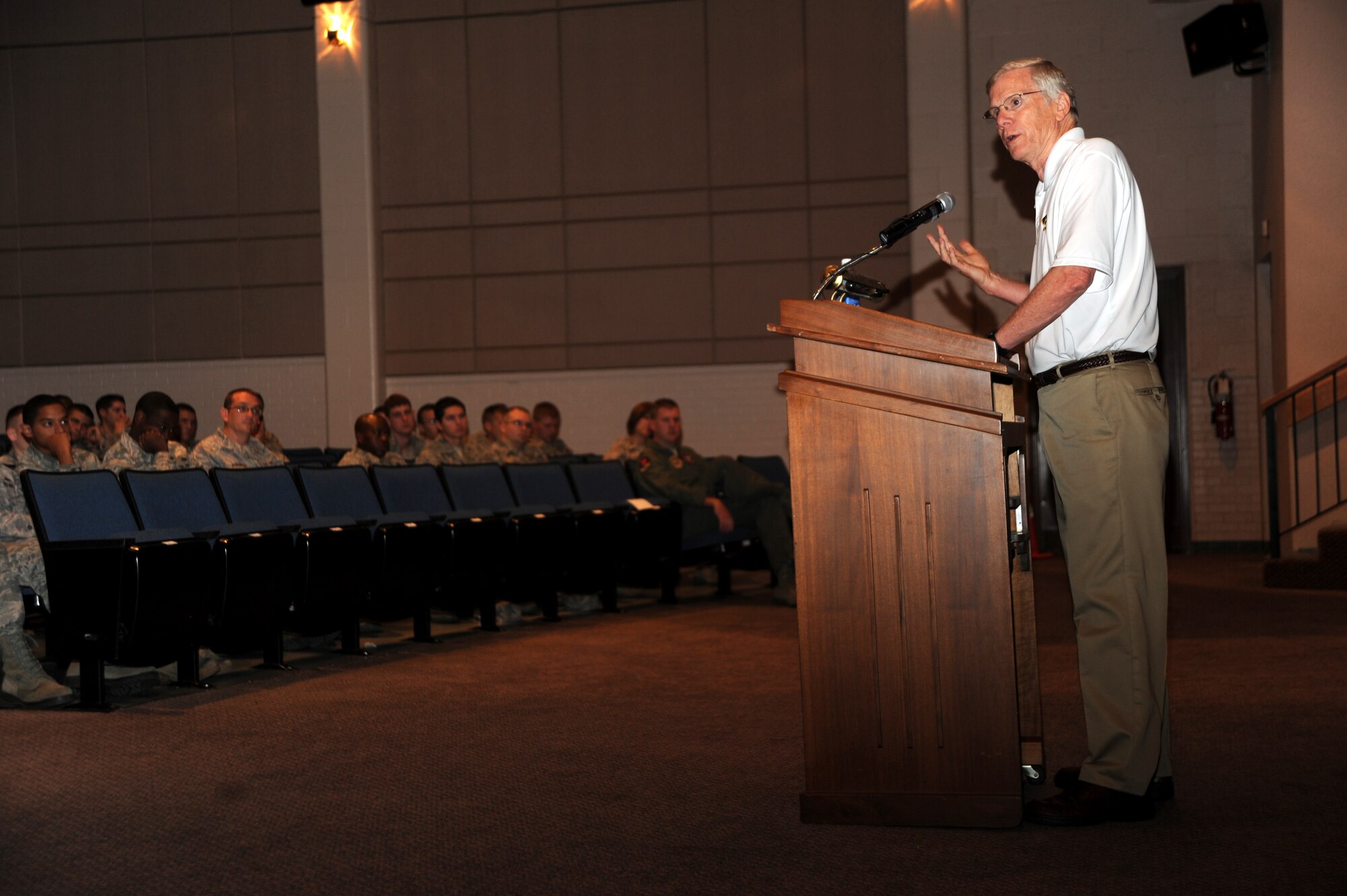 Dr. John Westefeld, University of Iowa counseling psychology professor, informs Team McConnell members about suicide prevention and awareness during a briefing at the base theater Aug. 25, 2011, McConnell Air Force Base, Kan.  Westefeld shared data about how suicide affects not only the individual, but also their loved ones.  Team McConnell members contemplating suicide or looking for additional information on suicide prevention can receive assistance at family advocacy, mental health clinic and base chapel or online at www.militaryonesource.com.  (U.S. Air Force photo/Airman 1st Class Jose L. Leon) 