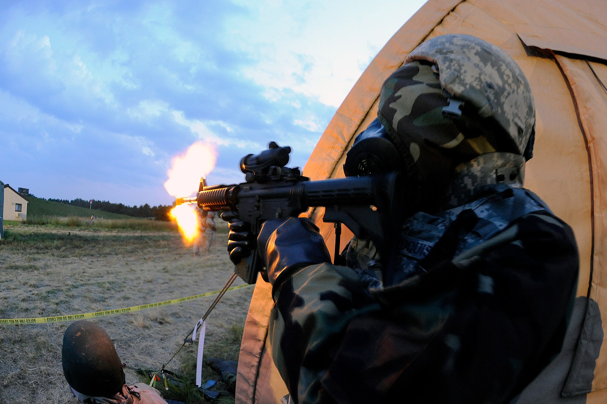 2nd Lt. Joseph Lindquist, 633rd Security Forces Squadron, fires an M-4 assault rifle at hostile forces during Exercise Eagle Flag at Joint Base McGuire-Dix-Lakehurst, N.J., Aug. 17. More than 250 Airmen and Soldiers from Joint Base Langley-Eustis recently returned from the week-long training exercise, which is designed to measure units’ ability to deploy and operate in austere environments. Fort Eustis deployed Soldiers from the 688th Rapid Port Opening Element to deliver cargo from the airfield, while Langley Air Force Base deployed Airmen from the 633rd Mission Support Group to establish and operate an expeditionary base. (U.S. Air Force photo by Tech. Sgt. Joanna Hensley/RELEASED)