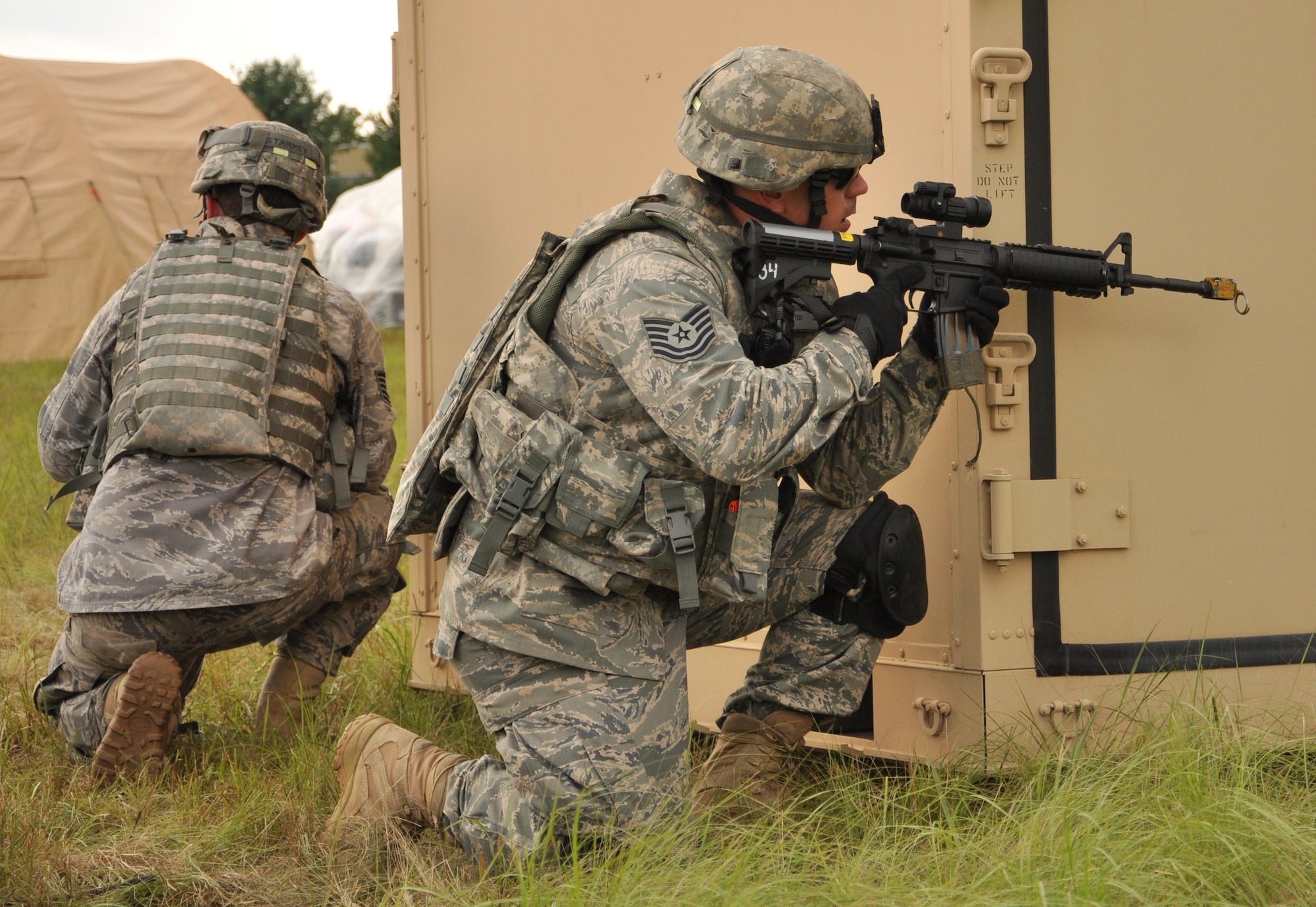 Tech. Sgt. Jonathan Starkey, 633rd Security Forces Squadron, performs “shoot, move, communicate” maneuvers during Exercise Eagle Flag at Joint Base McGuire-Dix-Lakehurst, N.J., Aug. 17. More than 250 Airmen and Soldiers from Joint Base Langley-Eustis recently returned from the week-long training exercise, which was designed to measure units’ ability to deploy and operate in austere environments. Fort Eustis deployed Soldiers from the 688th Rapid Port Opening Element to deliver cargo from the airfield, while Langley Air Force Base deployed Airmen from the 633rd Mission Support Group to establish and operate an expeditionary base. (U.S. Air Force photo by Senior Airman Jason J. Brown/RELEASED)