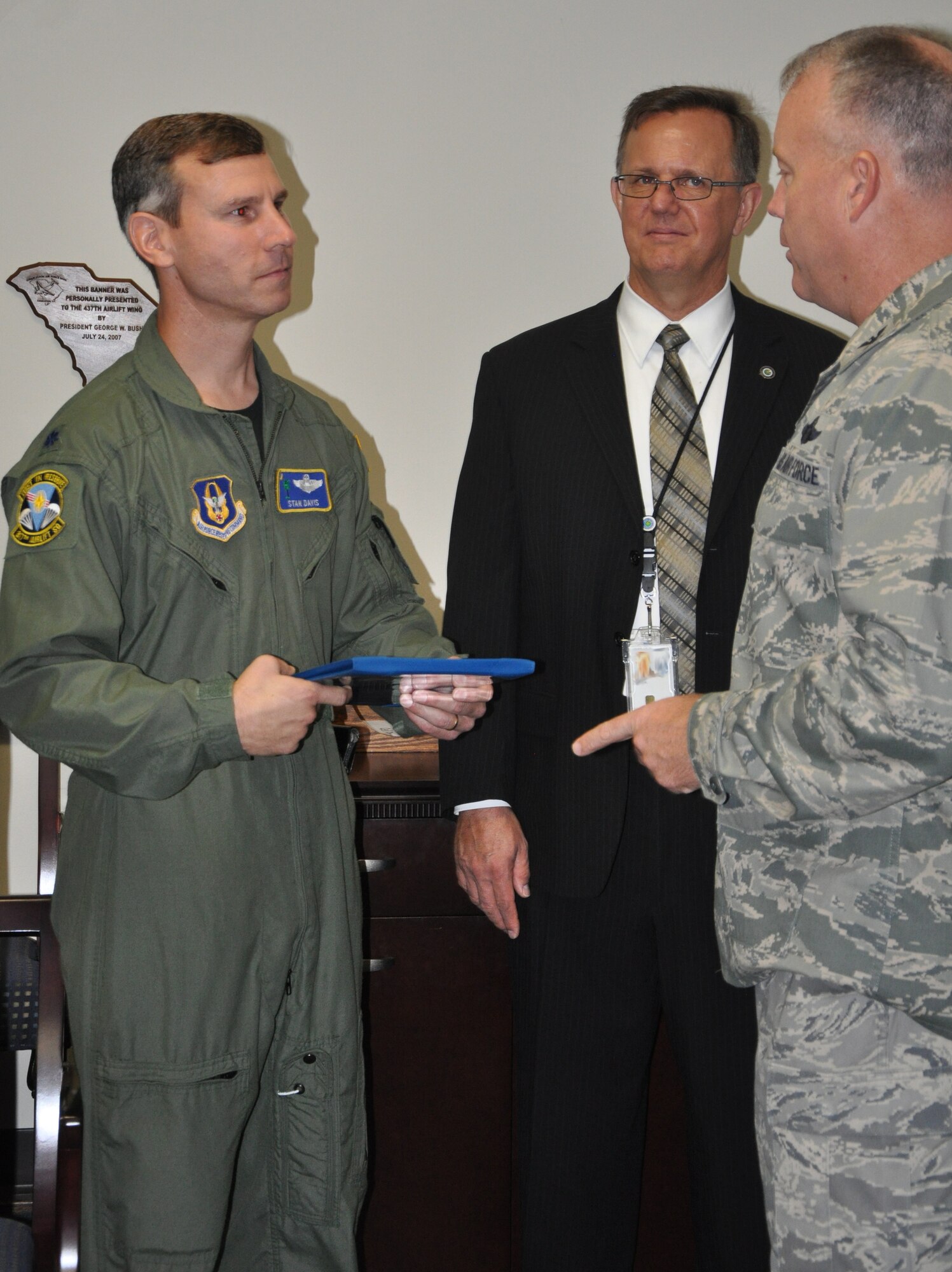 Lieutenant Colonel Stan Davis, 317th Airlift Squadron recieved a letter of recongition from Colonel Erik Hansen, Commander 437th Airlift Wing August 25 for his contributions to the new Optimized Profile Descent procedures at Joint Base Charleston. The new procedures are expected to save the Air Force several milllion dollars a year in fuel costs. (U.S. Air Force Photo/1st Lt Joe Simms)
