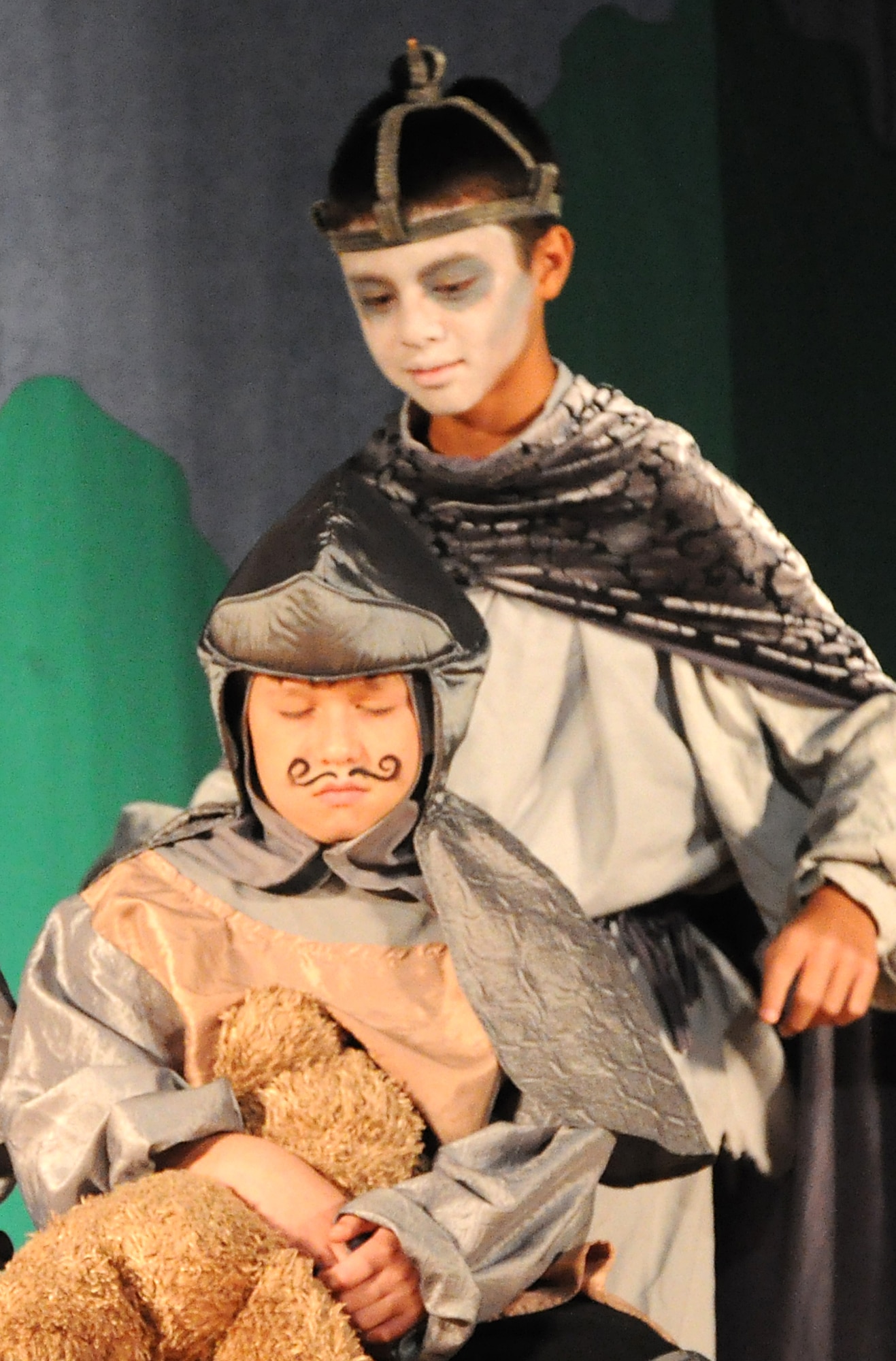 GOODFELLOW AIR FORCE BASE, Texas -- Yellow Knight, played by Jacob Ellington, is about to get a rude awakening from The Ghost of Uther Pendragon, played by Jonathan Liberman, during the Missoula Children's Theatre production of King Arthur's Quest Aug. 20 at the base theater here.  The Missoula Children's Theatre travels to 1,300 communities in the United States and in 17 countries each year fostering development life skills in more than a million youths.  (U.S. Air Force photo/Connie Hempel)
