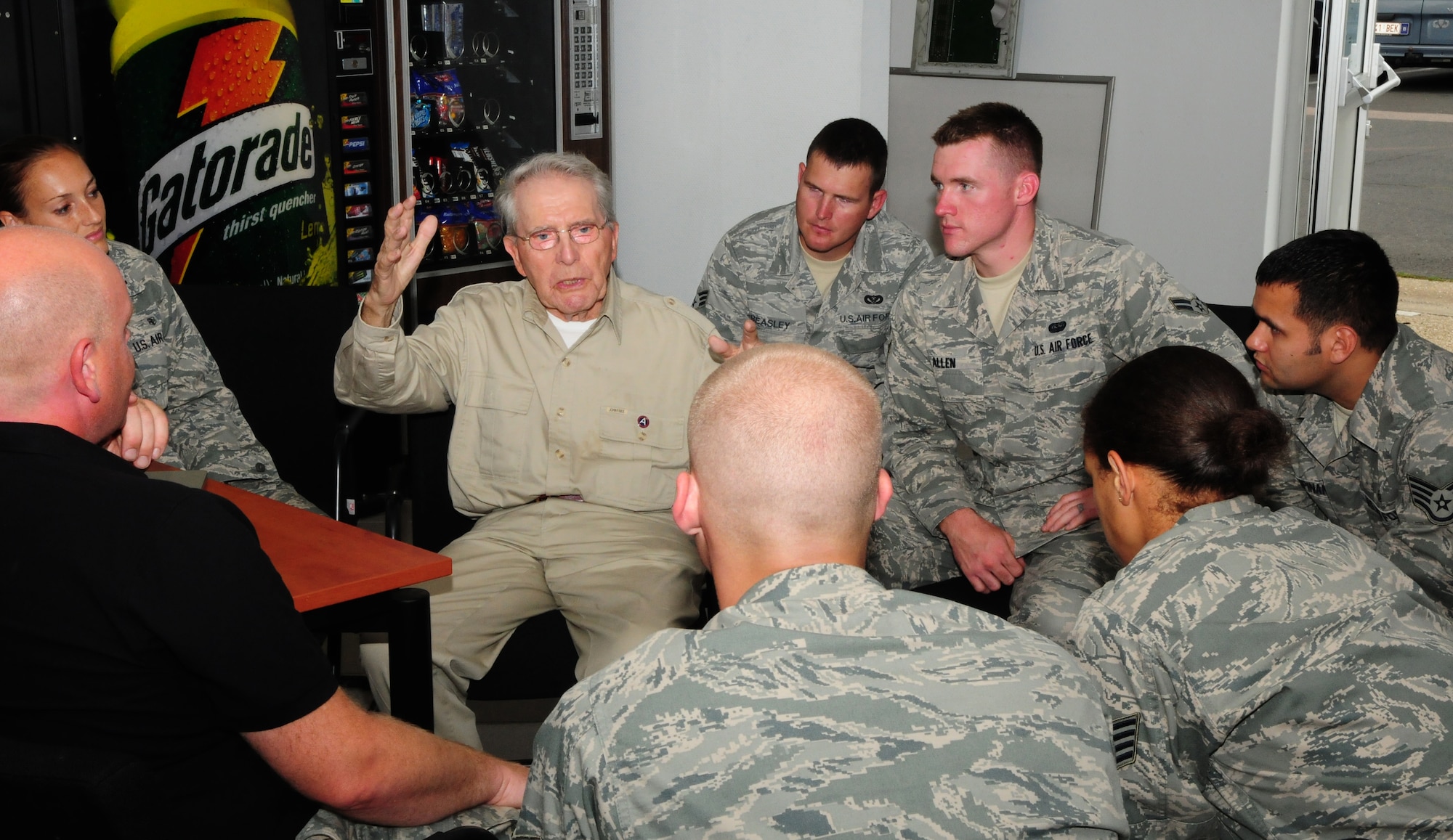 SPANGDAHLEM AIR BASE, Germany – Maurice Sperandieu, a Belgian World War II veteran, talks with 52nd Fighter Wing Honor Guard members here Aug. 23 about his time assigned to the U.S. Army during the war.  Sperandieu came to Spangdahlem with members of a Belgian WWII honor guard team that partners with the 52nd FW Honor Guard for joint events throughout Europe. Sperandieu encouraged today’s Airmen to remember the sacrifices of those who were killed in battle and recognize the cost of freedom. (U.S. Air Force photo/Airman 1st Class Matthew B. Fredericks)