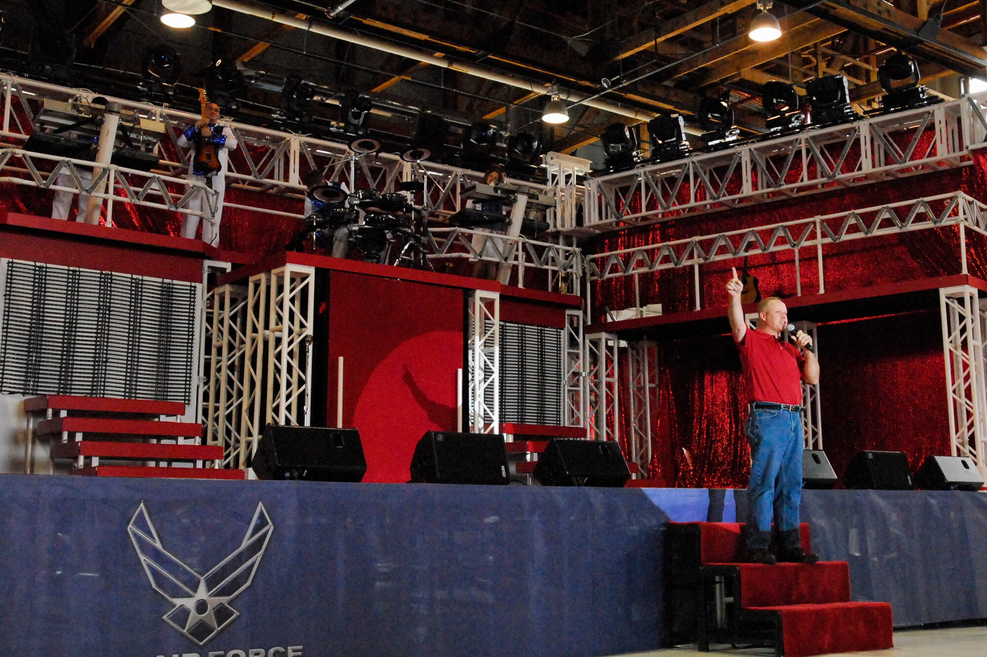 Col. Chris Crawford welcomes guests to a Tops in Blue performance on Peterson Air Force Base, Aug. 21. This year’s TiB tour theme is "Rhythm Nation." (U.S. Air Force photo/Senior Airman Jessica Hines)