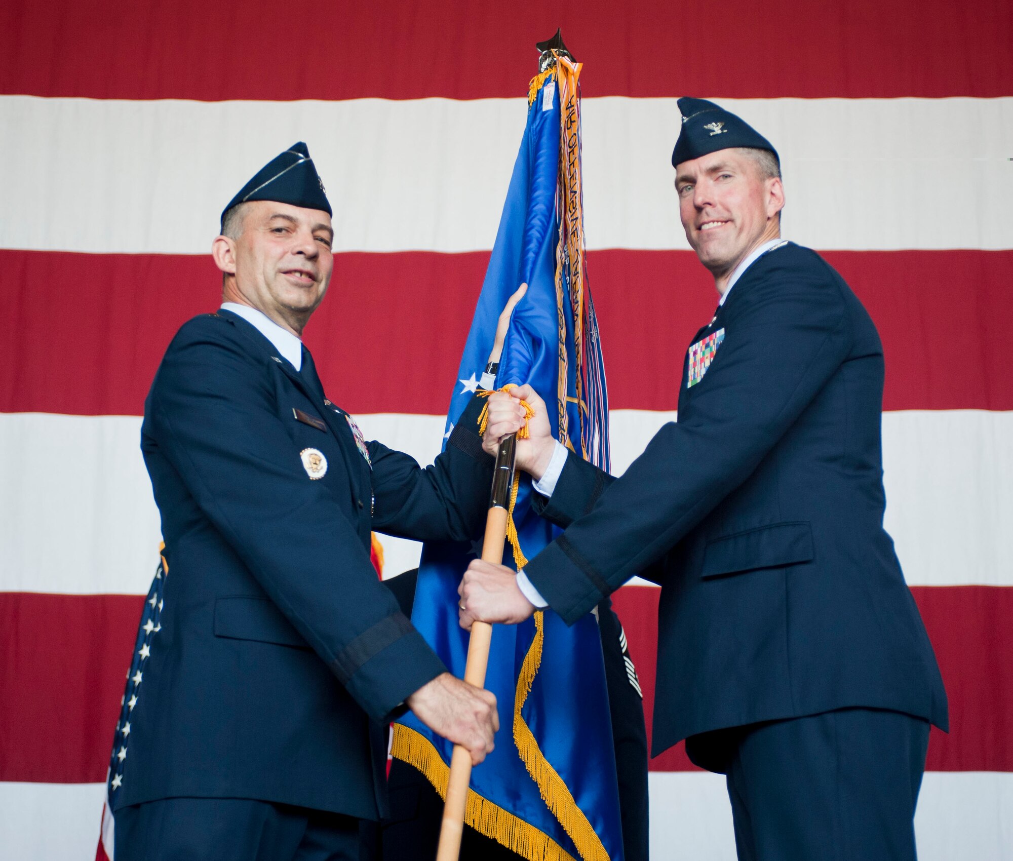 Col. Christopher Craige, 39th Air Base Wing commander, receives the guidon from Maj. Gen. Mark Zamzow, 3rd Air Force vice commander, during the 39th ABW assumption-of-command ceremony Aug. 25, 2011, at Incirlik Air Base, Turkey. Prior to coming to Incirlik, Craige was deployed to Joint Base Balad, Iraq, where he served as the 332nd Air Expeditionary Wing vice commander.(U.S. Air Force photo by Airman 1st Class Clayton Lenhardt/Released)
