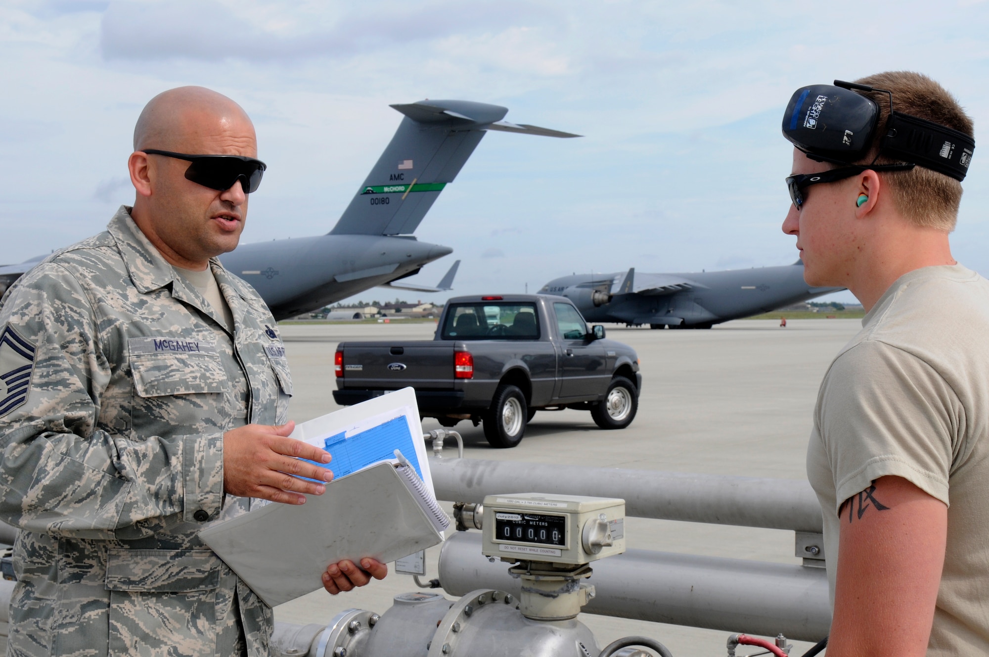 SPANGDAHLEM AIR BASE, Germany -- Senior Master Sgt. Eric McGahey, Air Combat Command Logistics Compliance Assessment Program inspector, left, informs Airman 1st Class Ryan Brown, 52nd Logistics Readiness Squadron hydrants operator, of the LCAP inspection here Aug. 24. The LCAP is held bi-annually to ensure all logistics and maintenance squadrons are able to perform key logistics processes in a compliant manner. (U.S. Air Force photo/Airman 1st Class Brittney Frees)