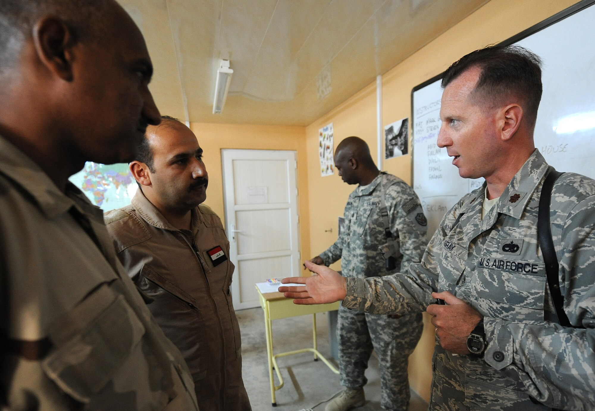 Maj. Mark Gray, 321st Air Expeditionary Advisory Group director of maintenance, meets up with other advisors to help teach the English language two hours a day, four days a week to the Iraqi maintainers at Kirkuk Air Base, Iraq. (U.S. Air Force photo by Senior Airman Tristin English)