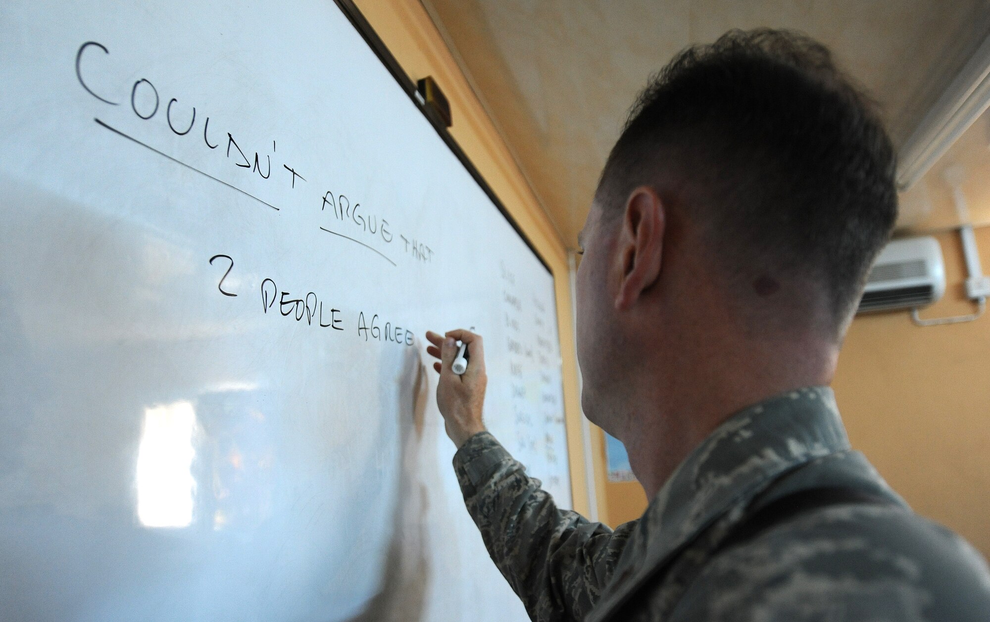 Maj. Mark Gray, 321st Air Expeditionary Advisory Group director of maintenance, helps teach the English language two hours a day, four days a week to the Iraqi maintainers at Kirkuk Air Base, Iraq. (U.S. Air Force photo by Senior Airman Tristin English)