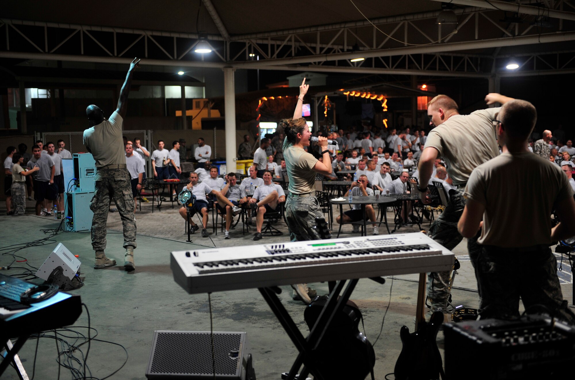 Sidewinder, the U.S. Air Forces Central Command band, performs for a packed house Aug., 20, 2011, at the 380th Air Expeditionary Wing. The band performed five times at multiple venues during their visit to the wing. Sidewinder played three full sets and two acoustic sets for the troops at all hours including a 1:30 a.m. show on the flightline. (U.S. Air Force photo/Tech. Sgt. Patrick Mitchell)
