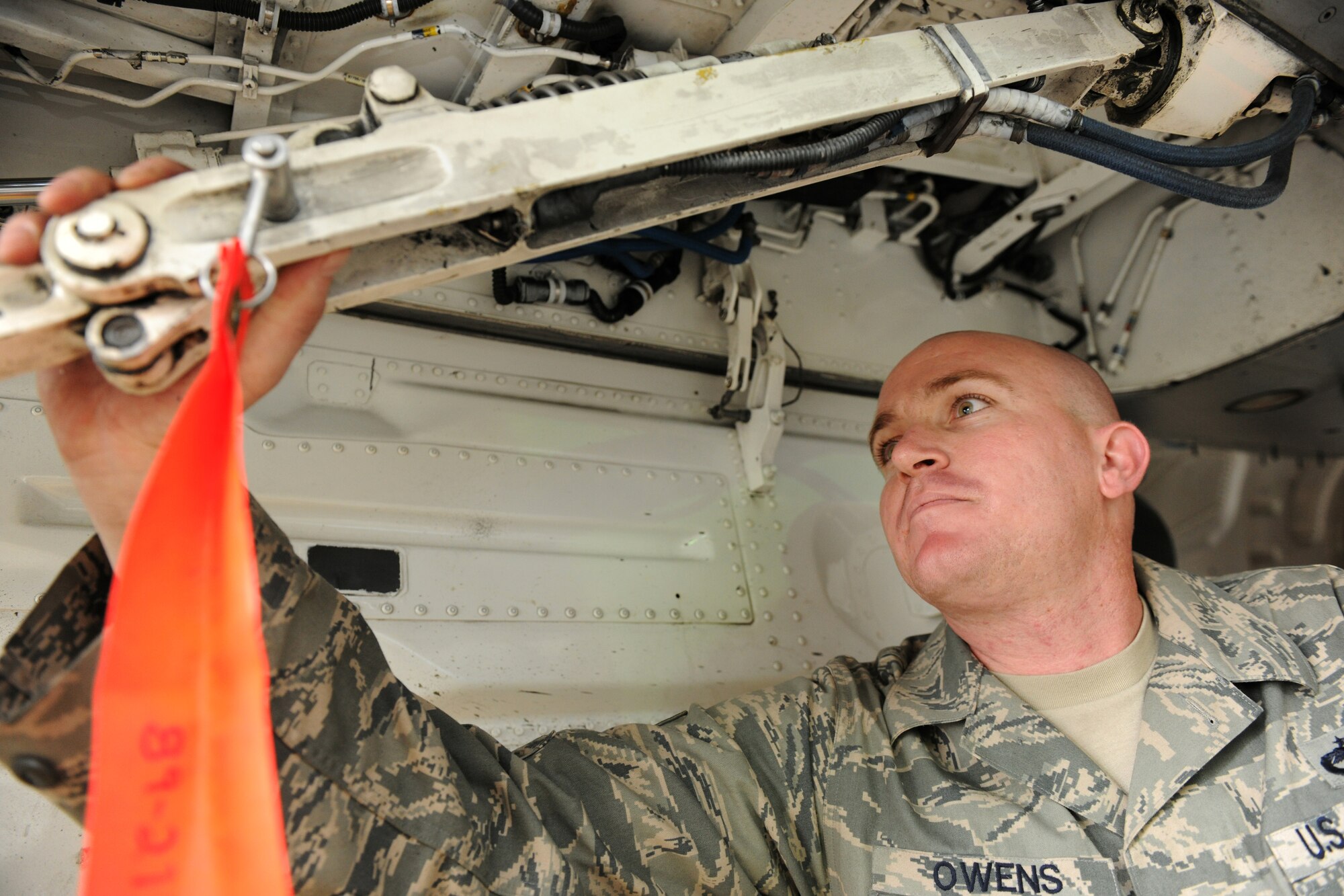 KUNSAN AIR BASE, Republic of Korea -- Staff Sgt. James Owens, 80th Aircraft Maintenance Unit crew chief, performs a preflight inspection here Aug. 24. Sergeant Owens is this week’s Pride of the Pack recipient. (U.S. Air Force photo/Senior Airman Brittany Y. Bateman)