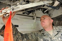 KUNSAN AIR BASE, Republic of Korea -- Staff Sgt. James Owens, 80th Aircraft Maintenance Unit crew chief, performs a preflight inspection here Aug. 24. Sergeant Owens is this week’s Pride of the Pack recipient. (U.S. Air Force photo/Senior Airman Brittany Y. Bateman)