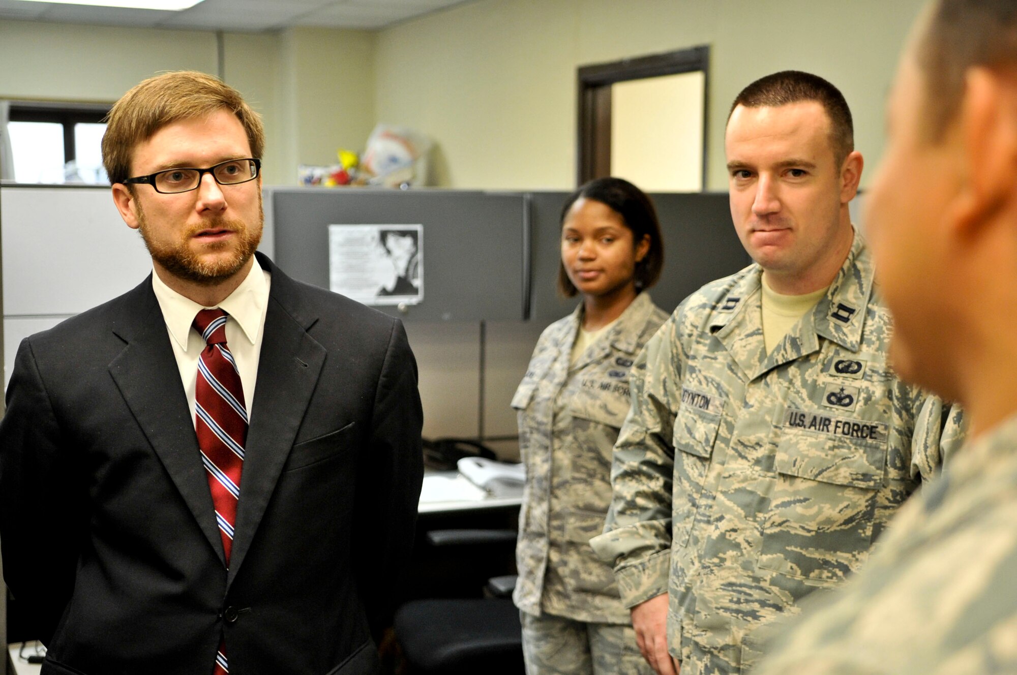 Assistant Secretary of the Air Force Jamie Morin converses Airmen from the 51st Comptroller Squadron during his tour here Aug. 19, 2011. The assistant secretary toured the base Aug. 18-21 on an 11-day orientation trip to PACAF. (U.S. Air Force photo/Senior Airman Adam Grant)