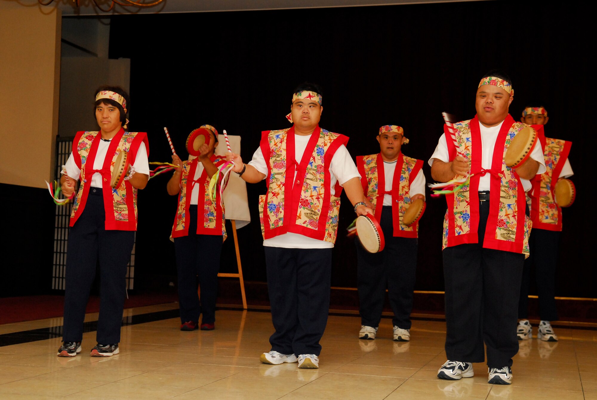 Kuwonomi Eisa dancers perform a traditional dance for commanders and their families at the Kadena Special Olympics Pep Rally at Kadena Air Base, Japan, Aug. 24. The Eisa dancers are students with the Kuwonmoi organization which holds workshops for locals with special needs. The dancers are also special-needs athletes. The KSO Pep Rally kicked off a series of events leading up to the 12th annual KSO one-day sporting and entertainment event with over 1,000 special-needs athletes and artists participating in a day of competition, music and special recognition. (U.S. Air Force photo/1st Lt. Natassia Cherne)
