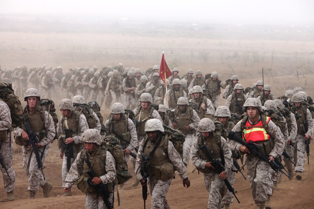 Marines from Combat Logistics Battalion 5 participate in their monthly battalion physical fitness session at Camp Pendleton, Calif., Aug. 25. The 7-mile hike was planned to condition the Marines for the battalion’s upcoming deployment.