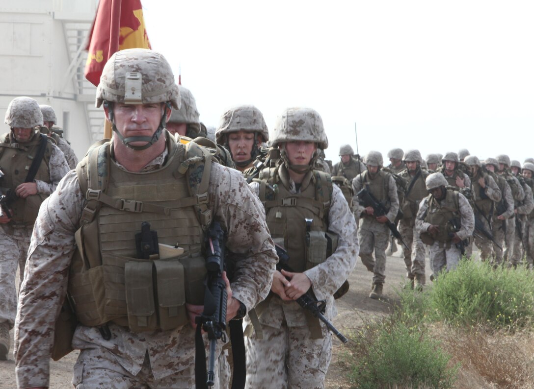 Sgt. Maj. Troy E. Black, the battalion Sergeant Major of Combat Logistics Battalion 5, 1st Marine Logistics Group, leads his battalion during a hike at Camp Pendleton, Calif., Aug. 25. The 7-mile hike was planned to condition the Marines for the battalion’s upcoming deployment next spring.