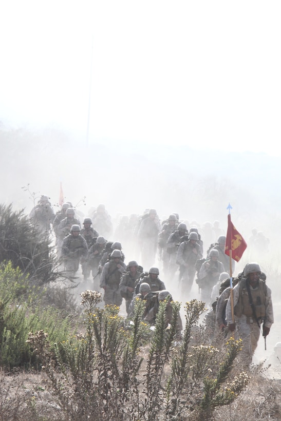 Marines from Combat Logistics Battalion 5 participate in their monthly battalion physical fitness session at Camp Pendleton, Calif., Aug. 25. The 7-mile hike was planned to condition the Marines for the battalion’s upcoming deployment.