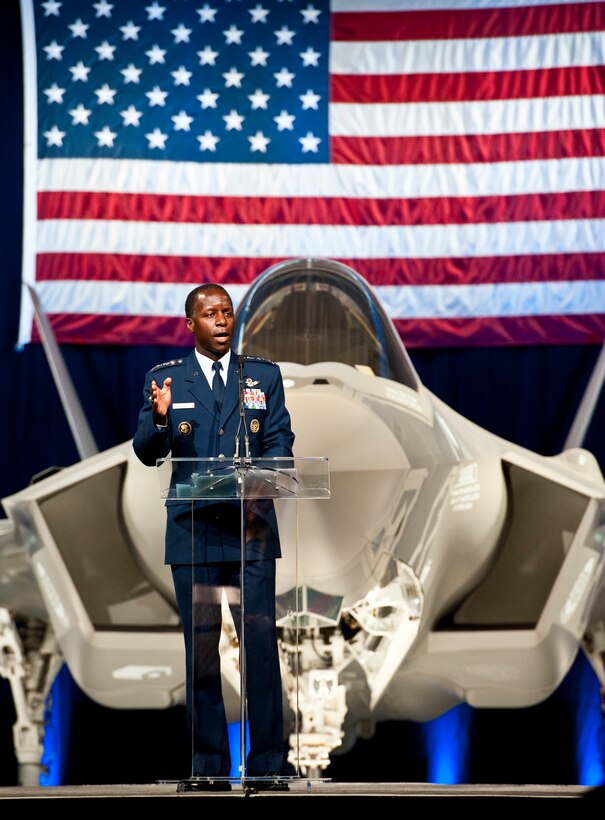 Gen. Edward Rice, the Air Education and Training Command commander, speaks to the crowd of 33rd Fighter Wing members and state and local leaders during the F-35 Lightning II joint strike fighter rollout ceremony Aug. 26 at Eglin Air Force Base, Fla.  (U.S. Air Force photo/Samuel King Jr.)