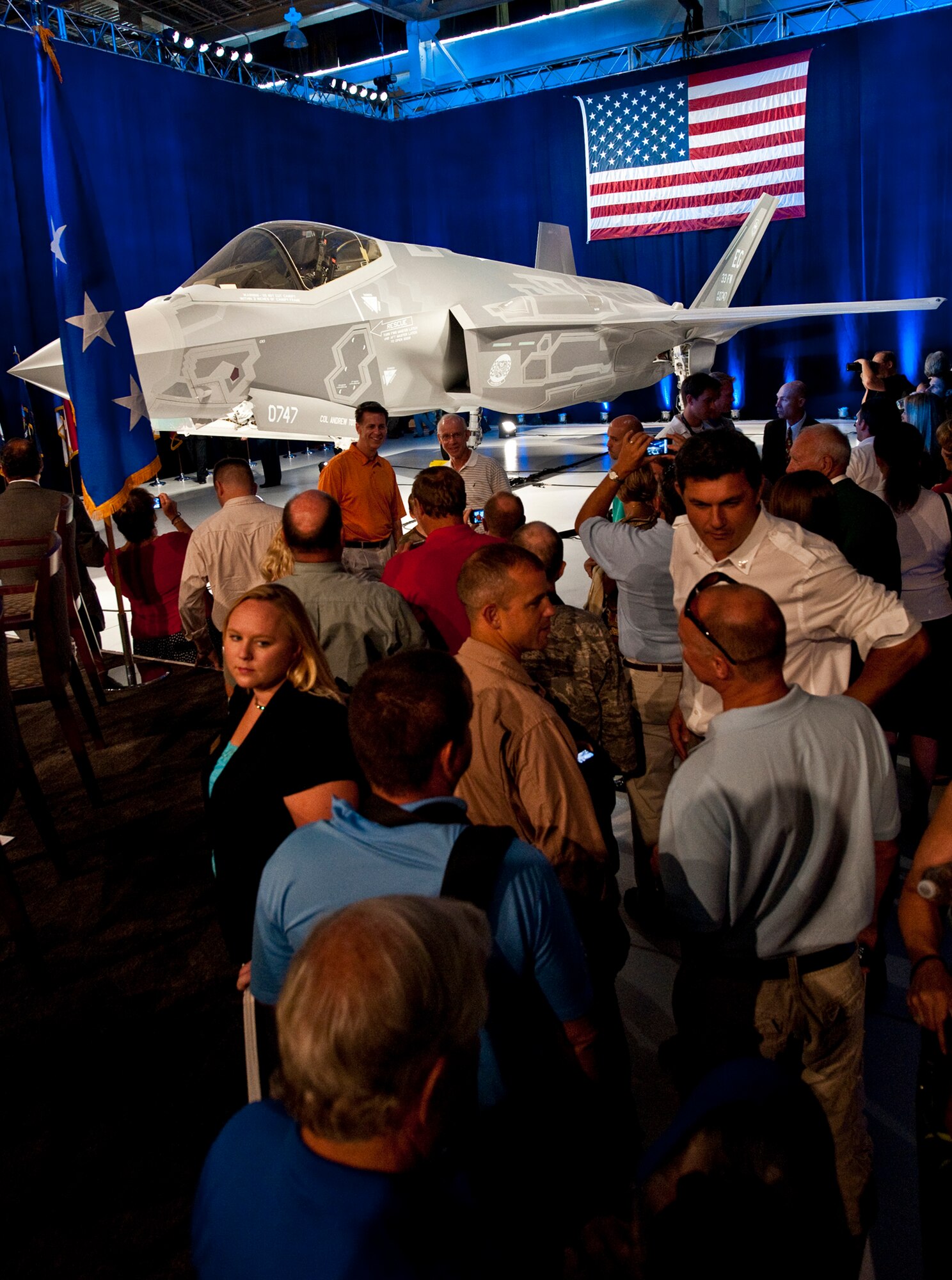 A crowd gathers to see the F-35 Lightning II joint strike fighter and take photos after its official rollout ceremony Aug. 26 at Eglin Air Force Base, Fla.  (U.S. Air Force photo/Samuel King Jr.)