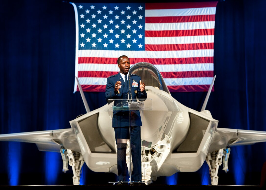 Gen. Edward Rice, the Air Education and Training Command commander, speaks to the crowd of 33rd Fighter Wing members and state and local leaders during the F-35 Lightning II joint strike fighter rollout ceremony Aug. 26 at Eglin Air Force Base, Fla.  (U.S. Air Force photo/Samuel King Jr.)