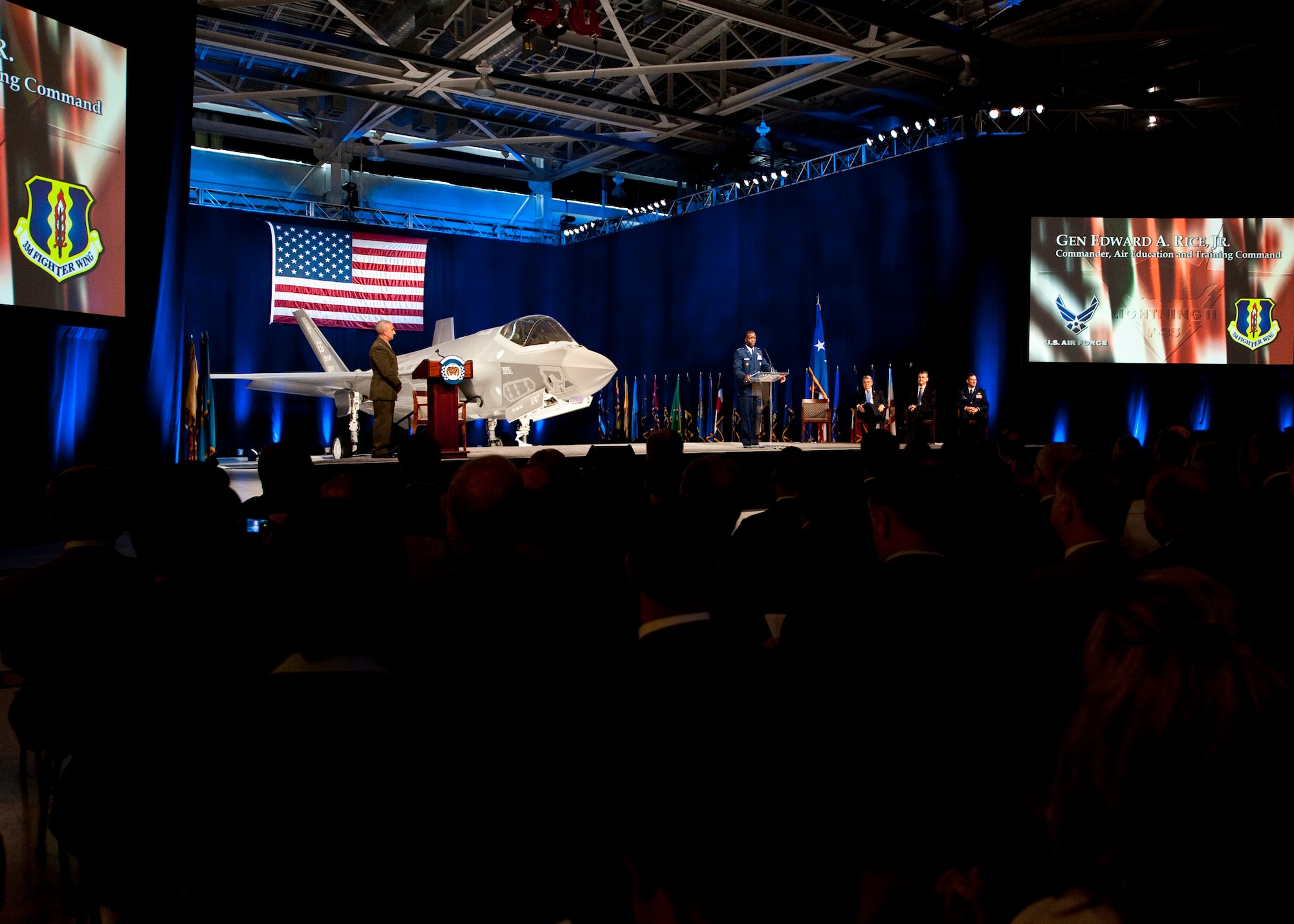 Gen. Edward Rice, the Air Education and Training Command commander, speaks to the crowd of 33rd Fighter Wing members and state and local leaders during the F-35 Lightning II joint strike fighter rollout ceremony Aug. 26 at Eglin Air Force Base, Fla.  (U.S. Air Force photo/Samuel King Jr.)