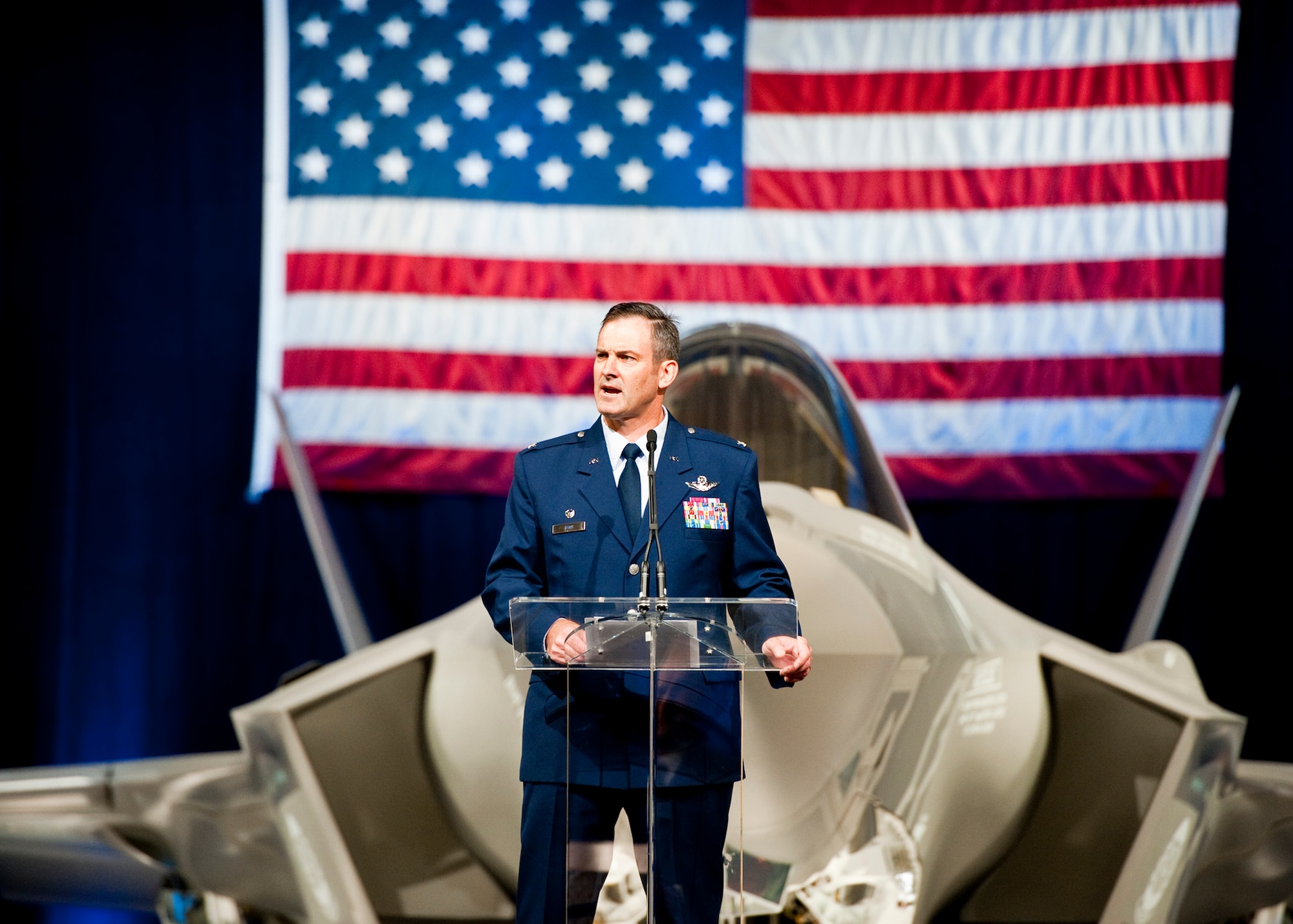 Col. Andrew Toth, the 33rd Fighter Wing commander, speaks to the crowd of 33rd Fighter Wing members and state and local leaders during the F-35 Lightning II joint strike fighter rollout ceremony Aug. 26 at Eglin Air Force Base, Fla.  (U.S. Air Force photo/Samuel King Jr.)