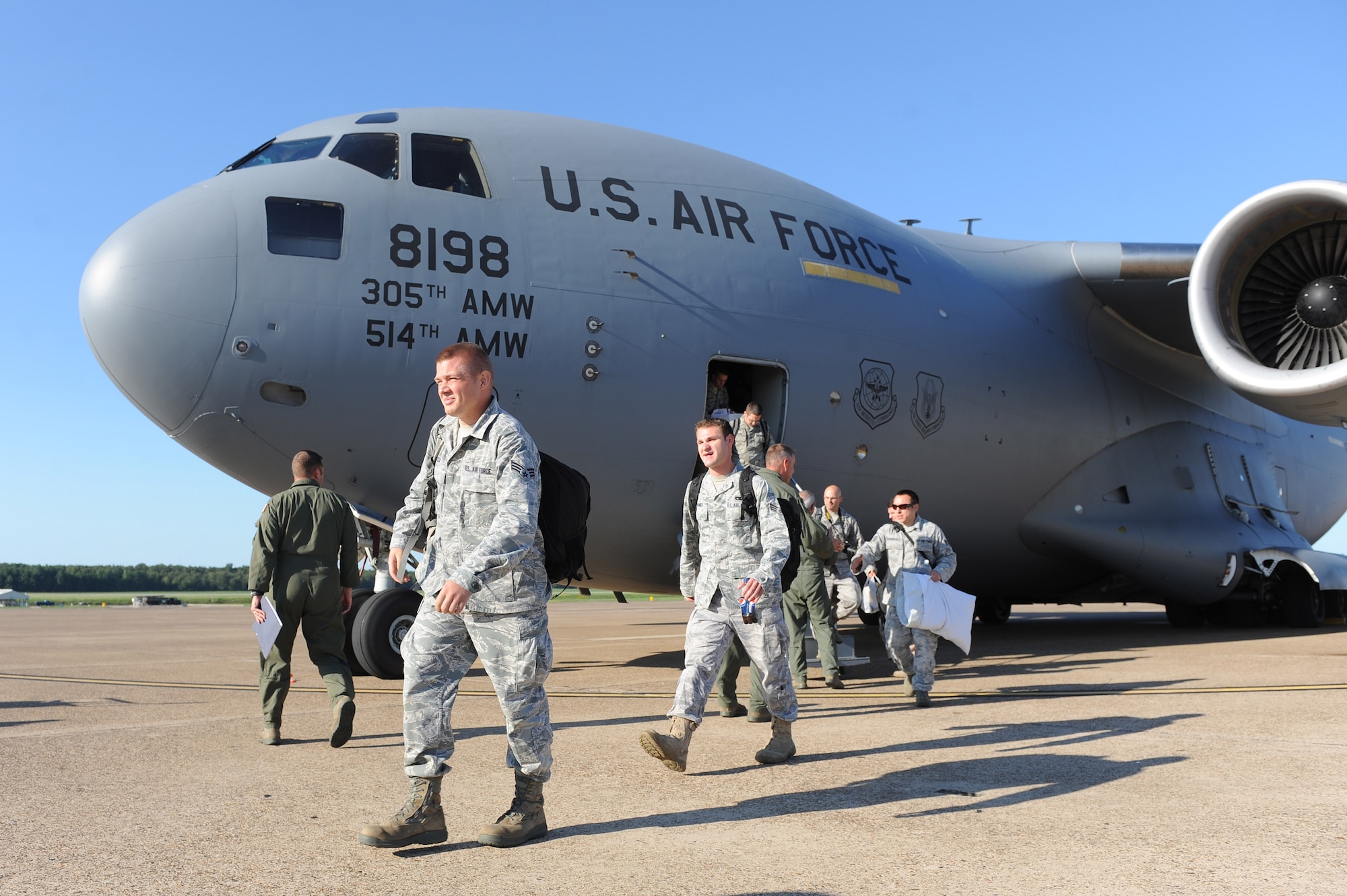 Airmen from the 621st Contingency Response Wing, Joint Base McGuire-Dix-Lakehurst, N.J., step out of a C-17 Globemaster III cargo plane on Aug. 26, 2011, at Little Rock Air Force Base, Ark. Approximately 150 Airmen from the 621st Contingency Response Wing at Joint Base McGuire-Dix-Lakehurst, N.J., evacuated to Little Rock AFB today as a precautionary measure to assure the planes are not damaged and that the response team is prepared to act after the landfall of Hurricane Irene. (U.S. Air Force photo by Tech. Sgt. Chad Chisholm)