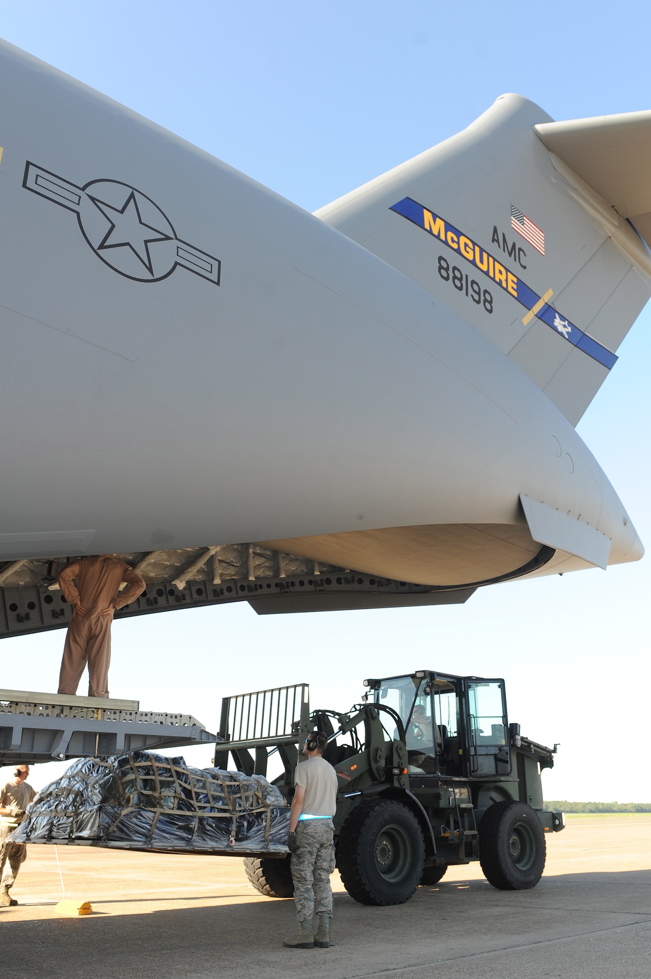 Members of the 19th Logistics Readiness Squadron unload a pallet from a C-17 Globemaster III from the 305th Air Mobility Wing on Aug. 26, 2011, at Little Rock Air Force Base, Ark. Approximately 150 Airmen from the 621st Contingency Response Wing at Joint Base McGuire-Dix-Lakehurst, N.J., evacuated to Little Rock AFB today as a precautionary measure to assure the planes are not damaged and that the response team is prepared to act after the landfall of Hurricane Irene. (U.S. Air Force photo by Tech. Sgt. Chad Chisholm)