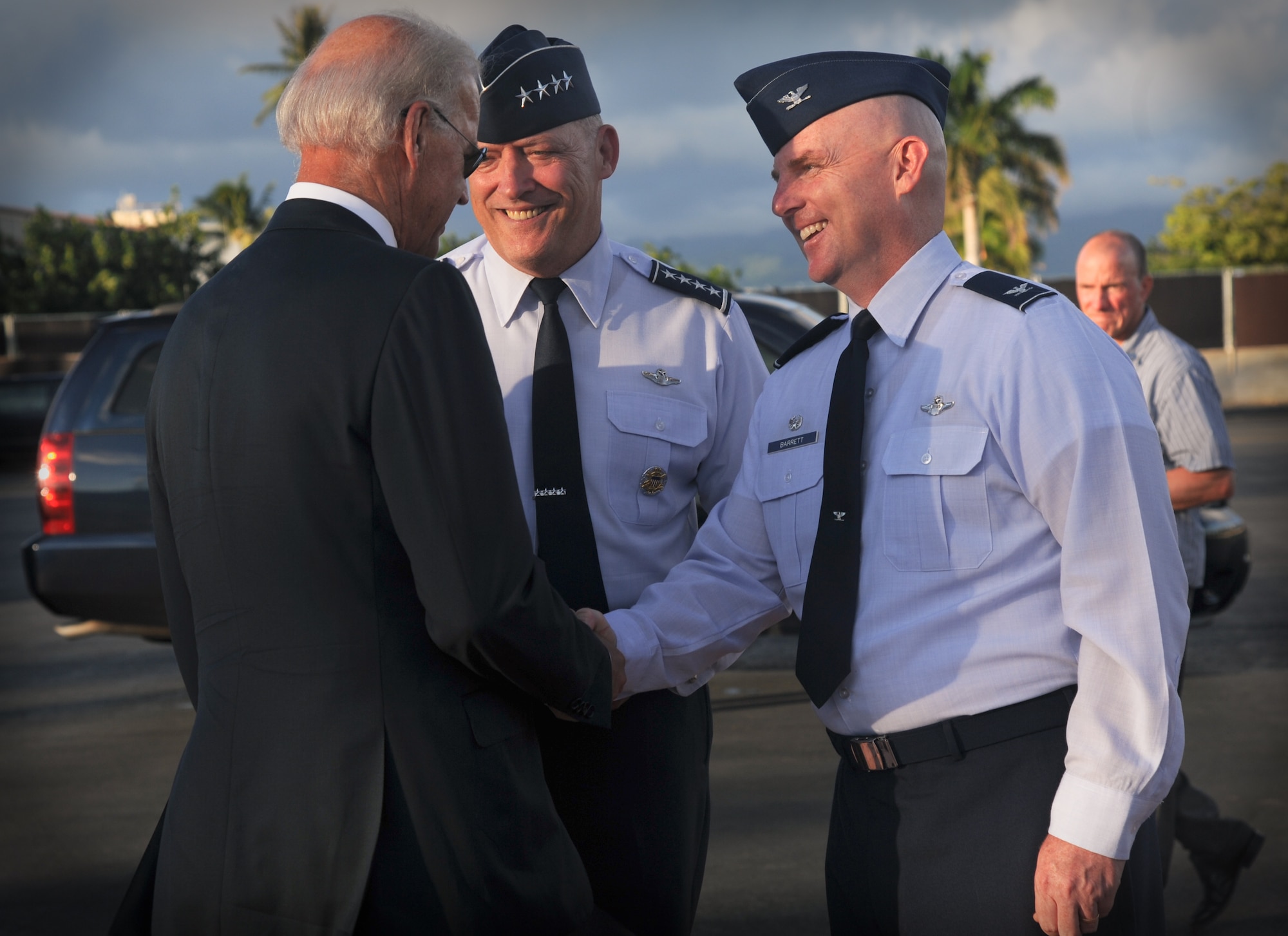 Vice President Biden greets Gen. Gary North, (middle) Pacific Air Forces commander, and Col. Sam Barrett (right) 15th Wing commander,  as he prepares to depart Joint Base Pearl Harbor-Hickam, Hawaii, Aug. 25. Biden made a brief stop on the island after returning from a visit overseas. (U.S. Air Force photo/Senior Airman Lauren Main)