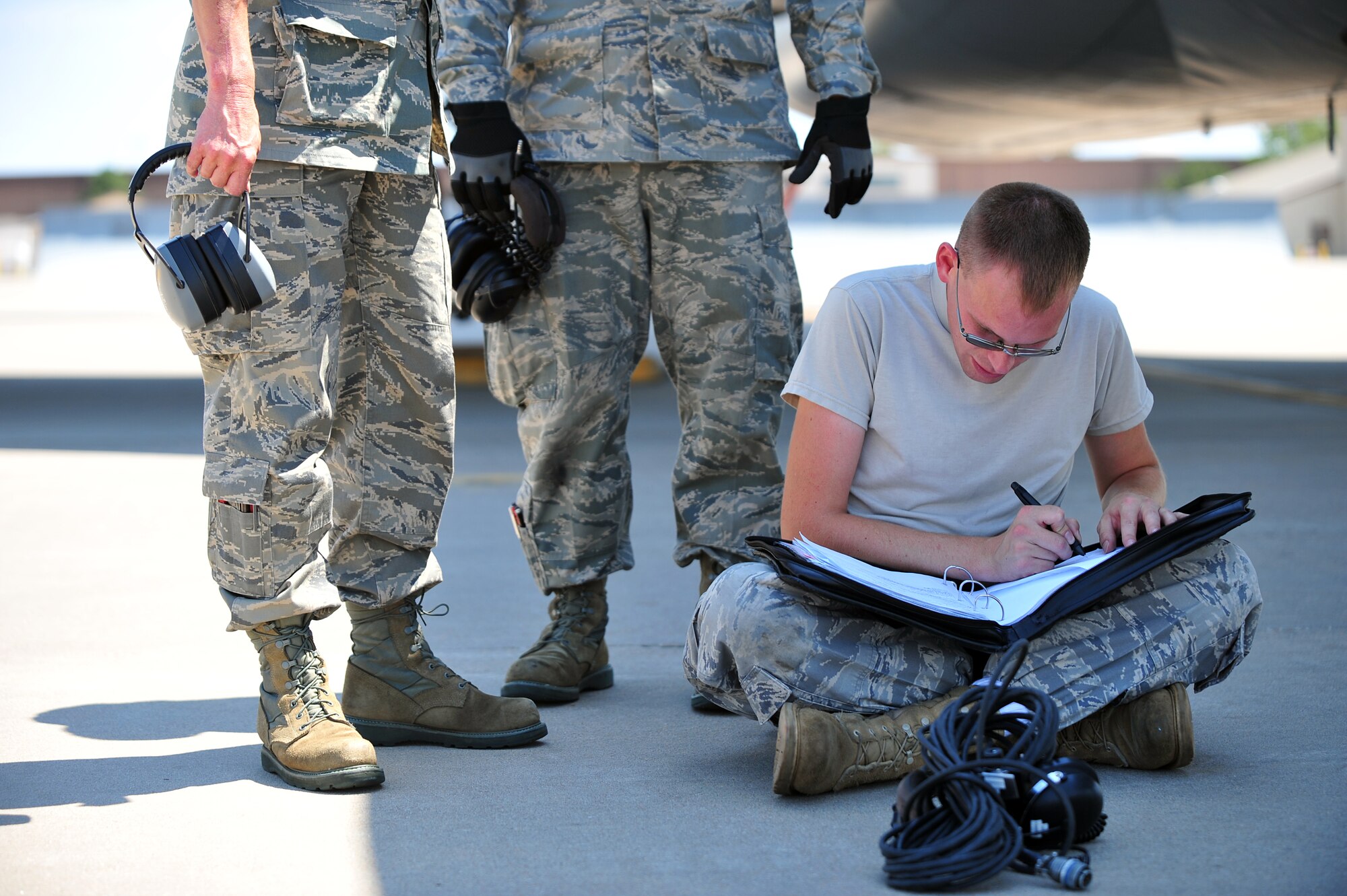 Tech. Sgt. Paul Blazewick, 108th Aircraft Maintenance Squadron crew chief, finalizes maintenance paperwork after arriving at McConnell Air Force Base, Kan., Aug. 26, 2011. Six Air National Guard KC-135 Stratotakers from the 108th Wing at Joint Base McGuire-Dix-Lakehurst, N.J., evacuated to McConnell in preparation for Hurricane Irene’s approach.  (U.S. Air Force photo by Senior Airman Courtney Witt)