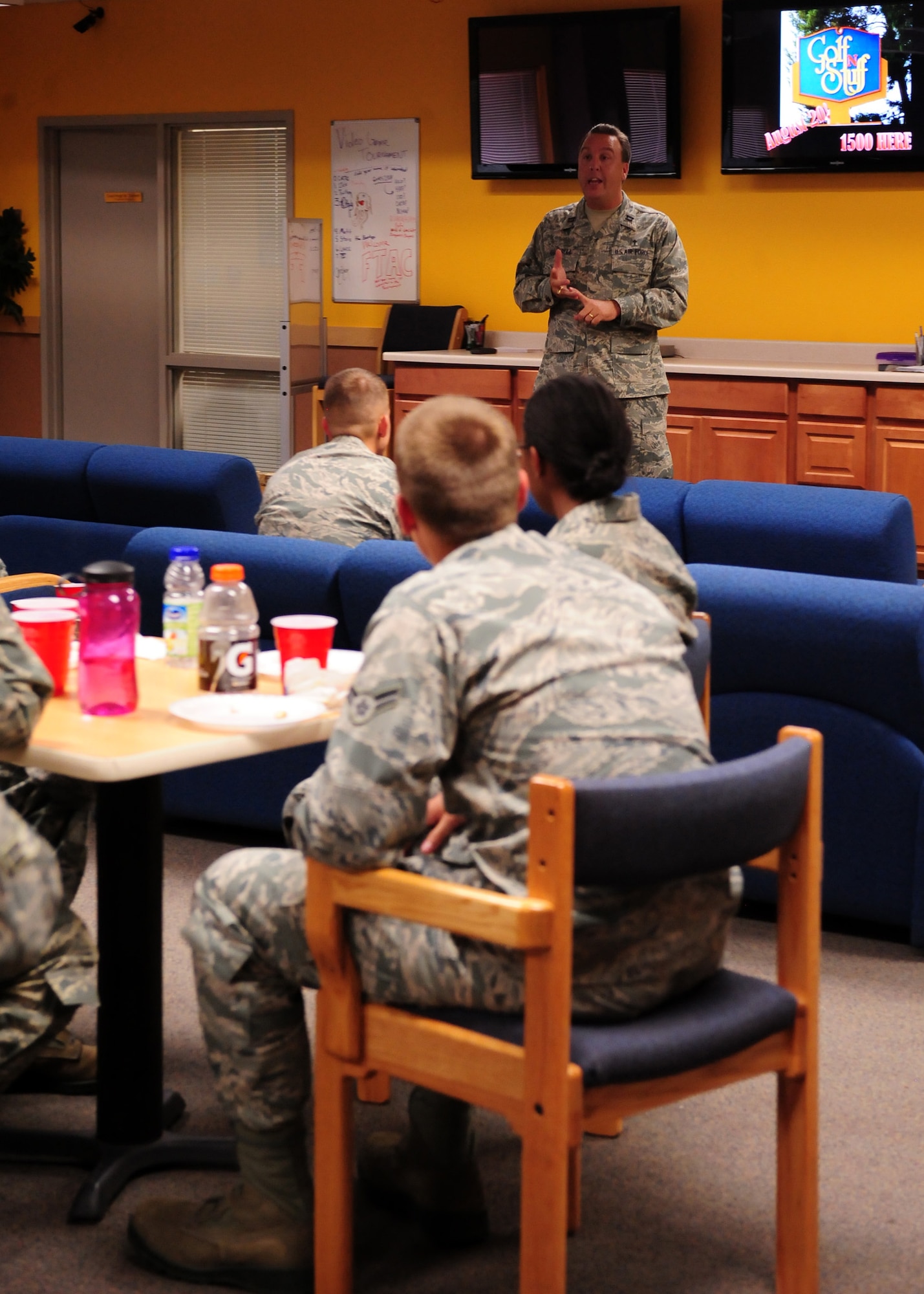 DAVIS-MONTHAN, Ariz. – Chaplain (Capt.) Hugh Cottrell, 355th Fighter Wing, talks to new Airmen of the 355th Fighter Wing about events hosted by the Loft here Aug. 18. The Loft is a place where Airmen can gather to rest, worship, or just hang out when not on the job. (U.S. Air Force photo/Airman 1st Class Timothy D. Moore)