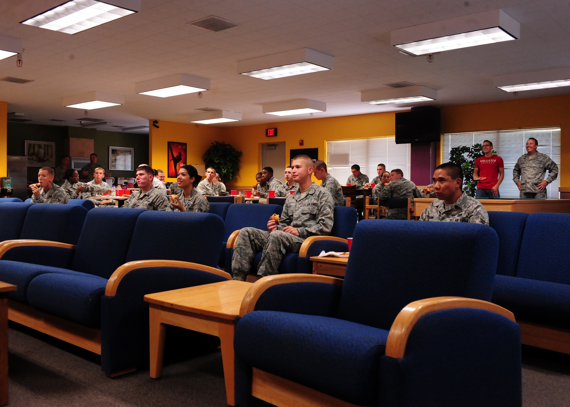 DAVIS-MONTHAN, Ariz. – Airmen from the 355th Fighter Wing watch a slideshow of past events hosted by the Loft here Aug. 18. The slideshow was the opening part of the Chaplain’s lunch. The Chaplain’s lunch is one of many scheduled events by the First Term Airman Center to introduce new Airmen to D-M. (U.S. Air Force photo/Airman 1st Class Timothy D. Moore)