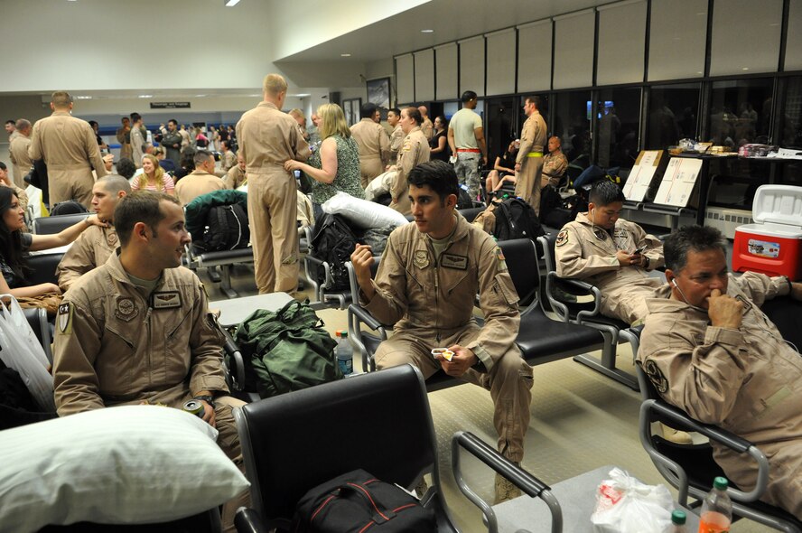 Airmen assigned to the 8th Airlift Squadron congregate in the Passenger Terminal before the squadron left for deployment August 25, 2011, at Joint Base Lewis-McChord, Wash. The Airmen departed McChord Field for a 120-day deployment in support of the Operations New Dawn and Enduring Freedom.  (U.S. Air Force photo/Airman 1st Class Leah Young)
