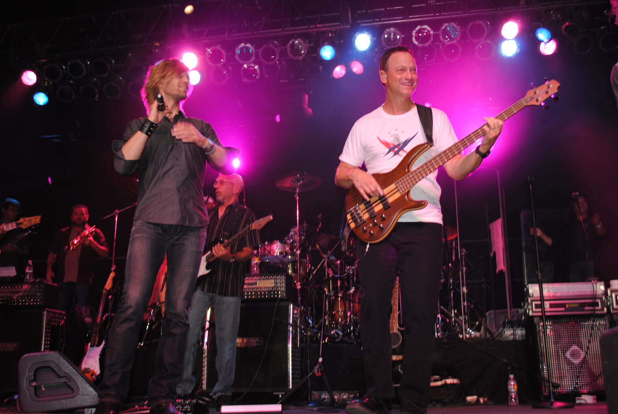 KIRTLAND AFB, N.M. -- Jeff Vezain, left, and Gary Sinise from the Lt. Dan Band perform Saturday during the third annual Ooh La La Wounded Warrior Benefit Dinner and Dance at Atlantic Aviation. (photo by Marie Vanover)