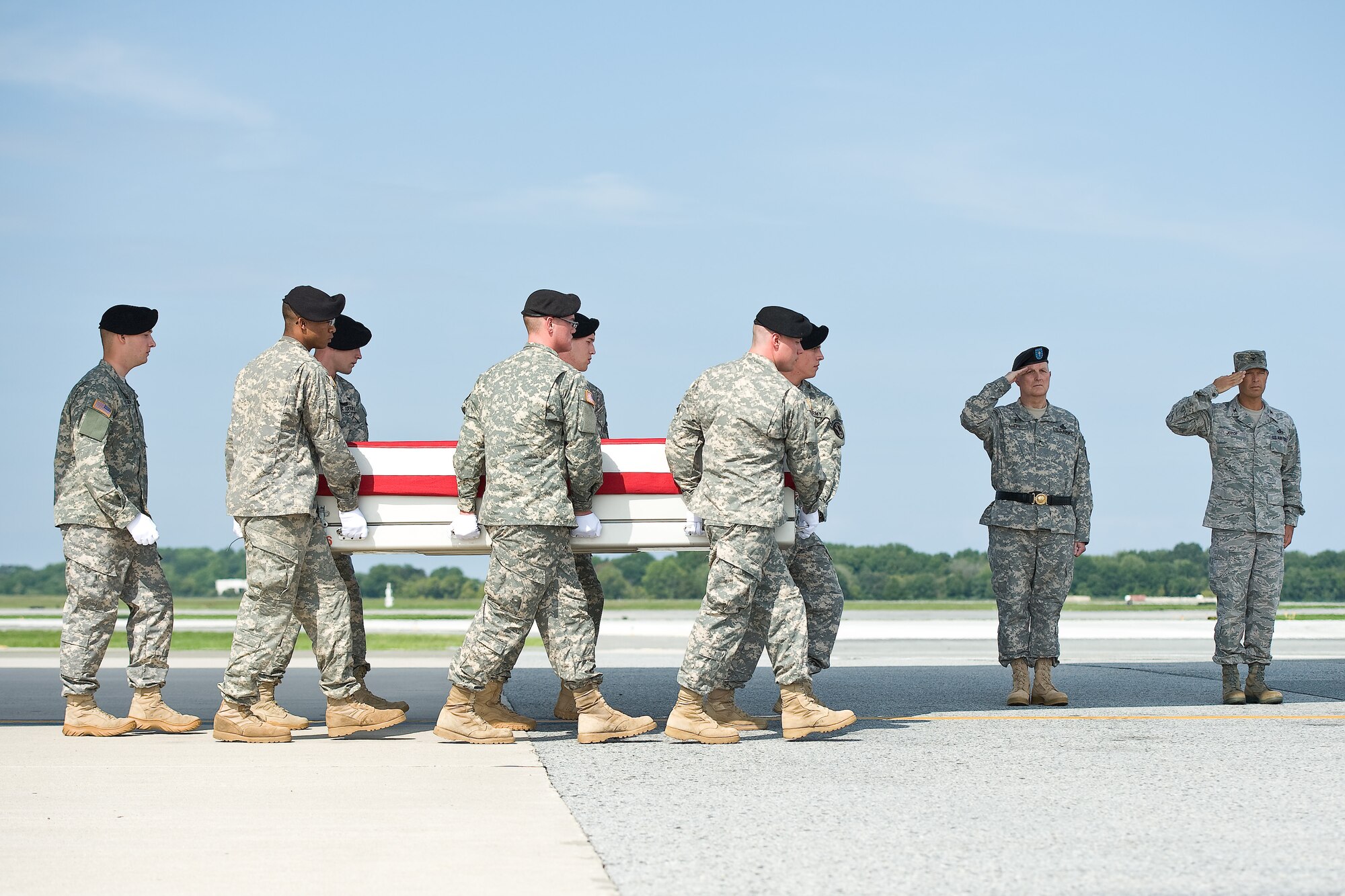 A U.S. Army carry team transfers the remains of Army Sgt. Andrew R. Tobin, of Jacksonville, Ill., at Dover Air Force Base, Del., Aug. 26, 2011.  Tobin was assigned to the 2nd Battalion, 87th Infantry Regiment, 3rd Brigade Combat Team, 10th Mountain Division, Fort Drum, N.Y. (U.S. Air Force photo/Roland Balik)

