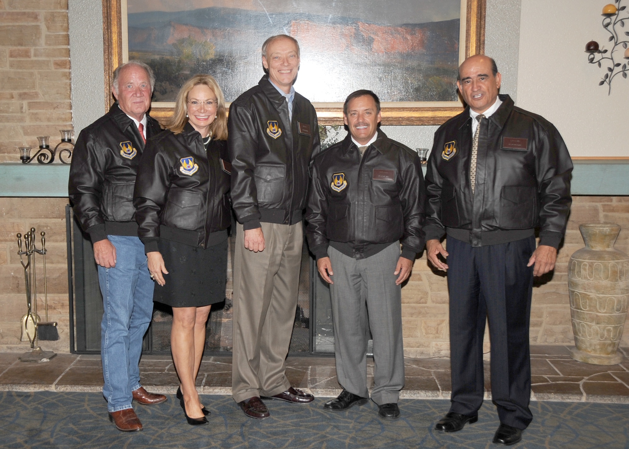 KIRTLAND AFB, N.M. -- Five community leaders were inducted Aug. 17 as Kirtland Wingman for their support of Kirtland Air Force Base. The five leaders are, from left, Sherman McCorkle, Kirtland Partnership Committee vice chair and chairman and CEO, Sandia Science and Technology Park Development Corp.; Terri Cole, president/CEO, Greater Albuquerque Chamber of Commerce; Dave Seely, president, Kirtland Federal Credit Union; John Garcia, director, Albuquerque Economic Development; and Alex Romero, CEO/president, Albuquerque Hispano Chamber of Commerce.. (photo by Dennis Carlson)