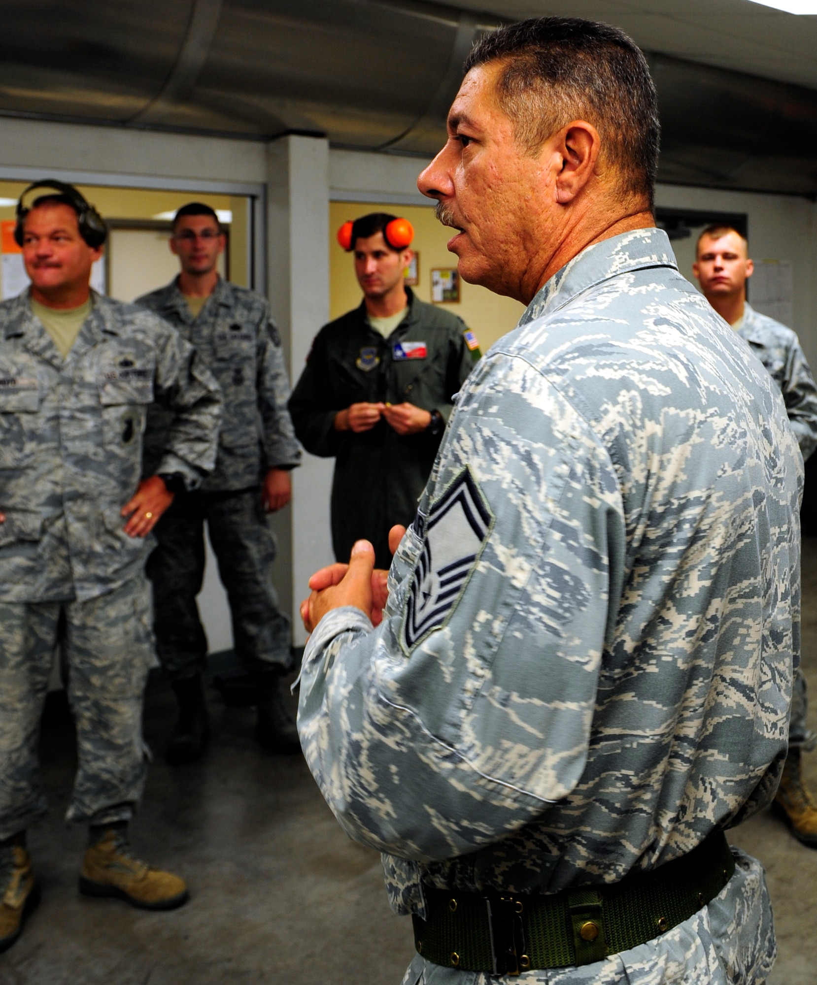 Senior Master Sgt. Ronald Meredith, 610th Security Forces Squadron chief range officer, provides instructions and procedures to a relay of competitors before an Excellence in Competition match, hosted by the 610th SFS at Naval Air Station Fort Worth JRB, Texas August 24. (U.S. Air Force photo/Senior Airman Martha Whipple)