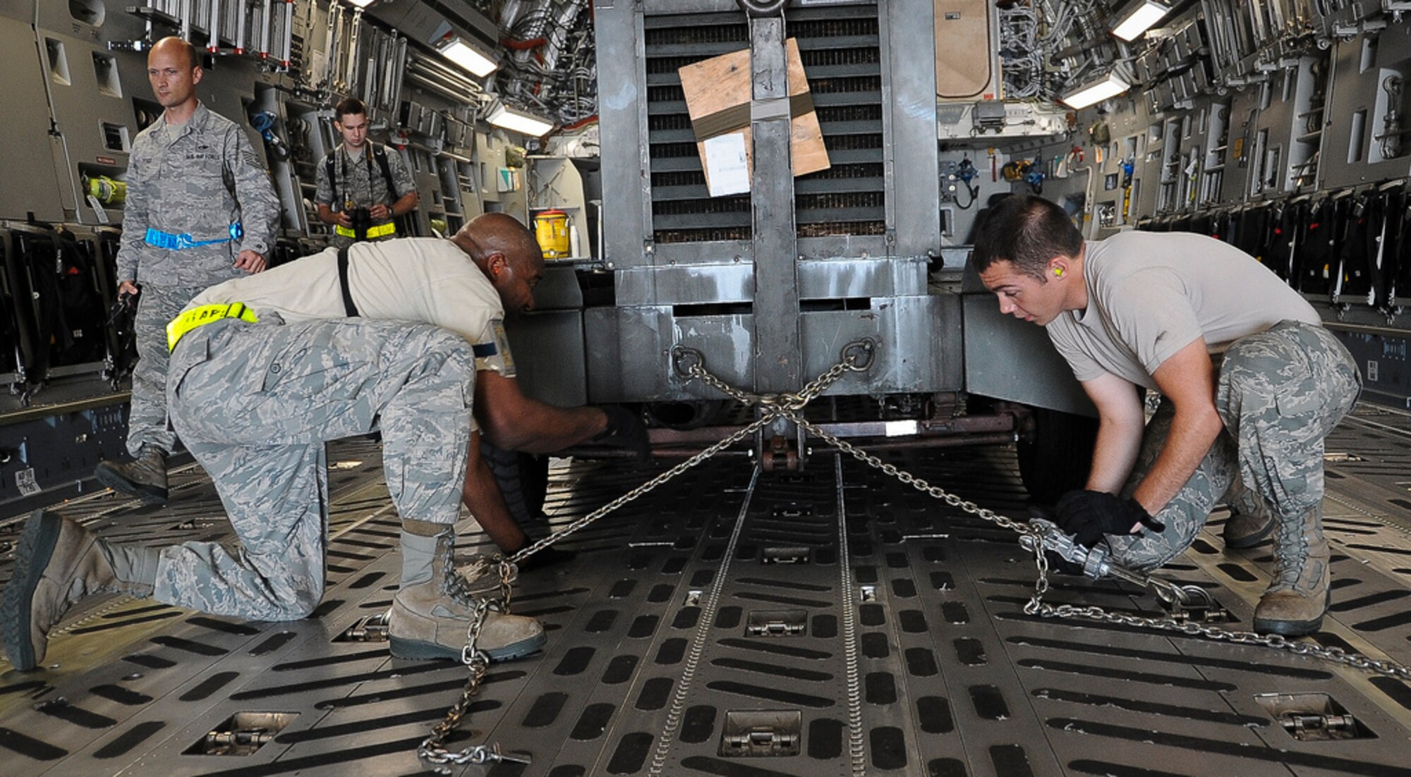Joint Base McGuire-Dix-Lakehurst Airmen load and secure equipment onto aircraft in preparation of Hurricane Irene. All JB MDL aircraft are being evacuated to Air Force Base's around the country. Community members in and around JB MDL should secure items and take necessary precautions during the hurricane. Visit the JB MDL public website and the Facebook page for updates. (U.S. Air Force photo by Airman 1st Class Dennis Sloan/Released)