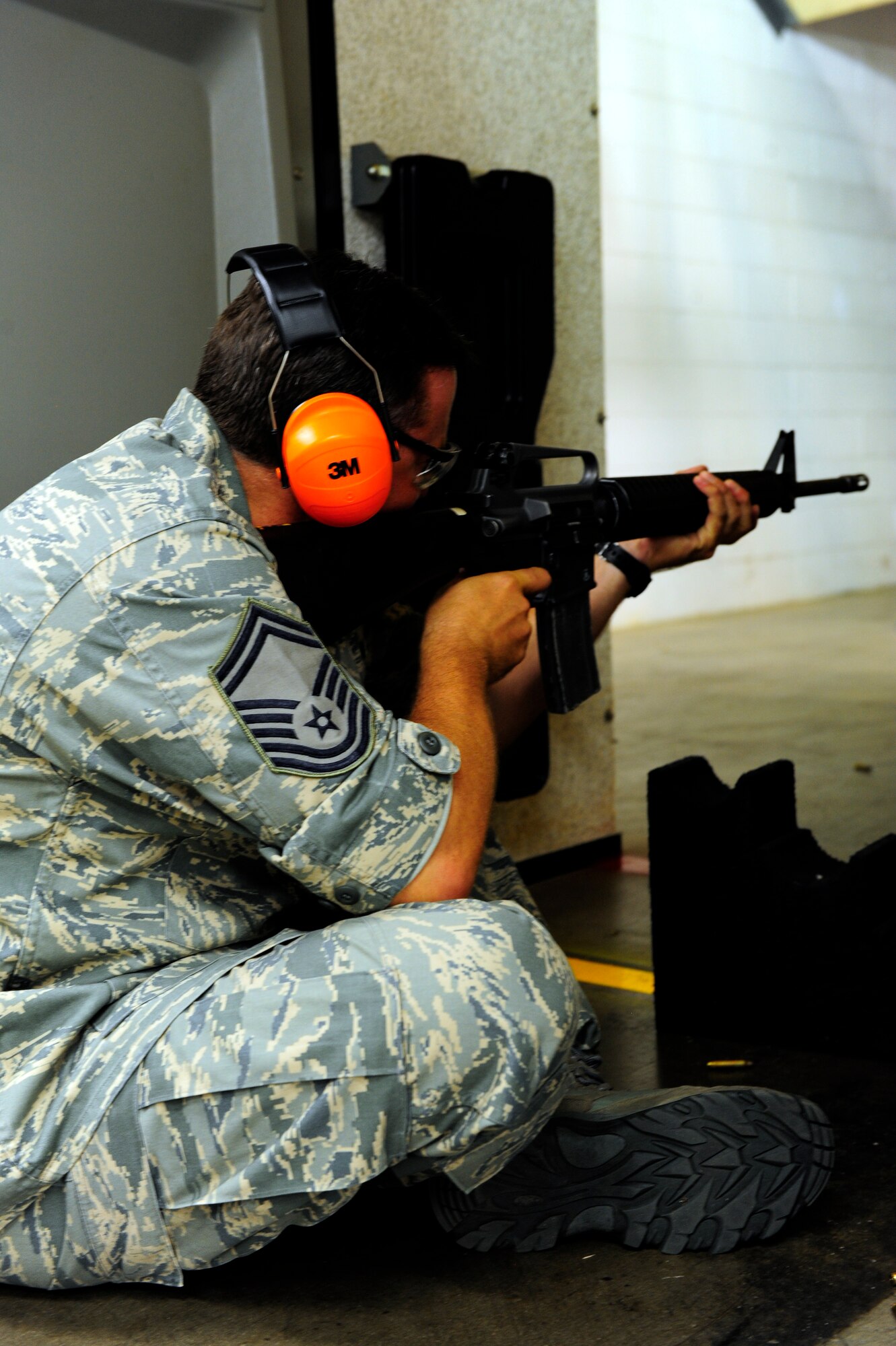 Senior Master Sgt. Gordon Blair, 301st Security Forces Squadron, fires from the sitting position in an Excellence in Competition match, hosted by the 610th Security Forces Squadron at Naval Air Station Fort Worth JRB, Texas August 24.  Blair scored 427 out of 500 to win third place and an EIC badge. The 18-year veteran police officer works for the Lewisville Police Department and has served with the military here for 16 years. (U.S. Air Force photo/Senior Airman Martha Whipple)