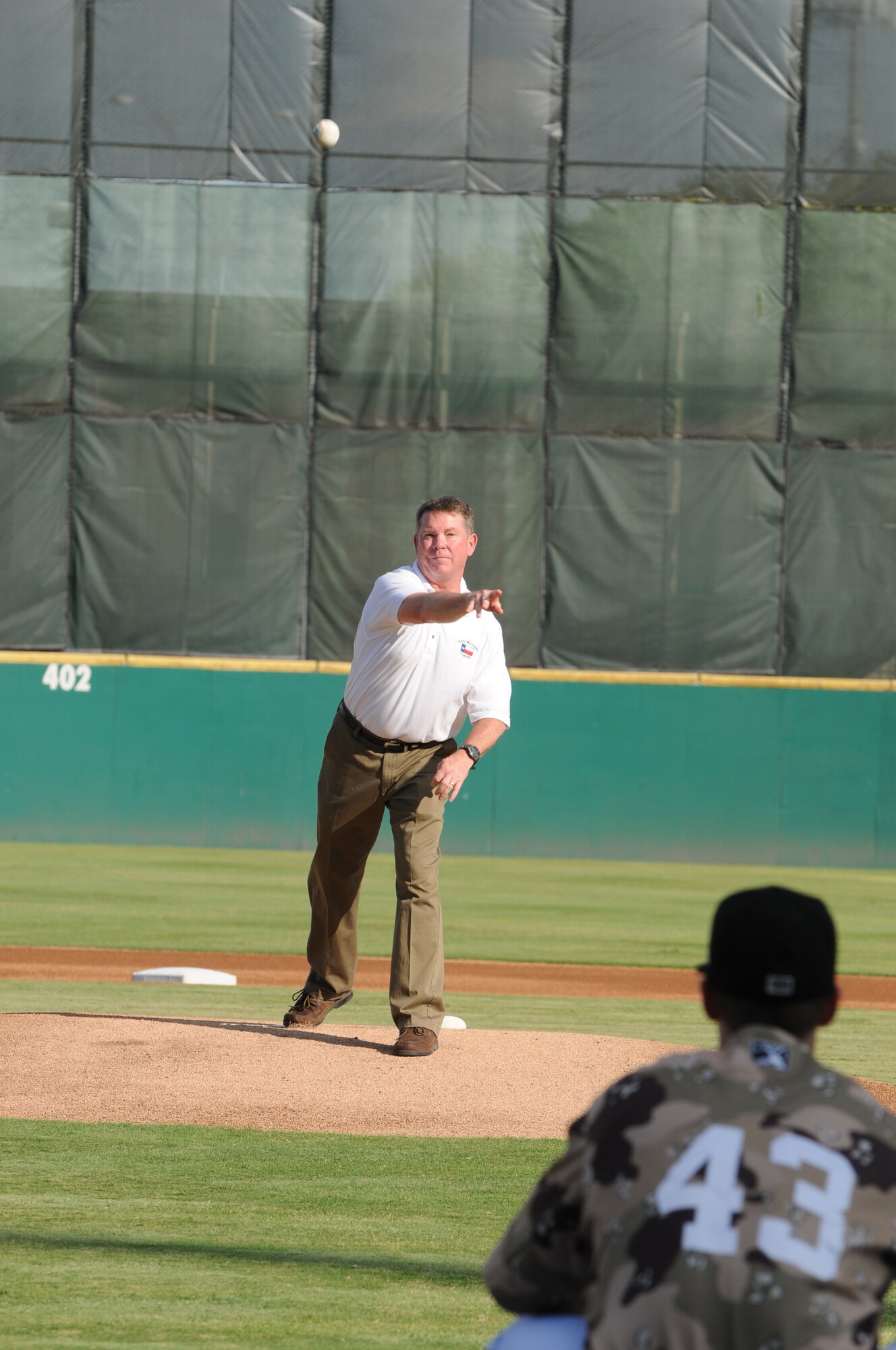 Major General (Maj. Gen.) John Nichols, Texas' Adjutant General, throws out a ceremonial "first-pitch" during Texas Air National Guard night with the San Antonio Missions AA baseball club, August 21, 2011.  (Air National Guard photo by SSgt Eric L. Wilson/Released)