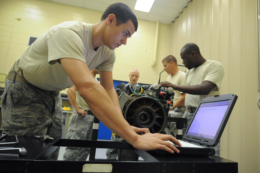 U.S. Air Force Airman 1st Class Alan Webb, 23rd Component Maintenance Squadron, reads over a technical instruction on the steps to take apart a T-700 engine during the Turbo Shaft Propulsion Course held at the 372nd Training Squadron Aug. 23, 2011. The course teaches maintainers stationed at Moody Air Force Base, Ga., how to properly tear down and rebuild HH-60 Pave Hawk engines. (U.S. Air Force photo by Staff Sgt. Joshua J. Garcia/Released)