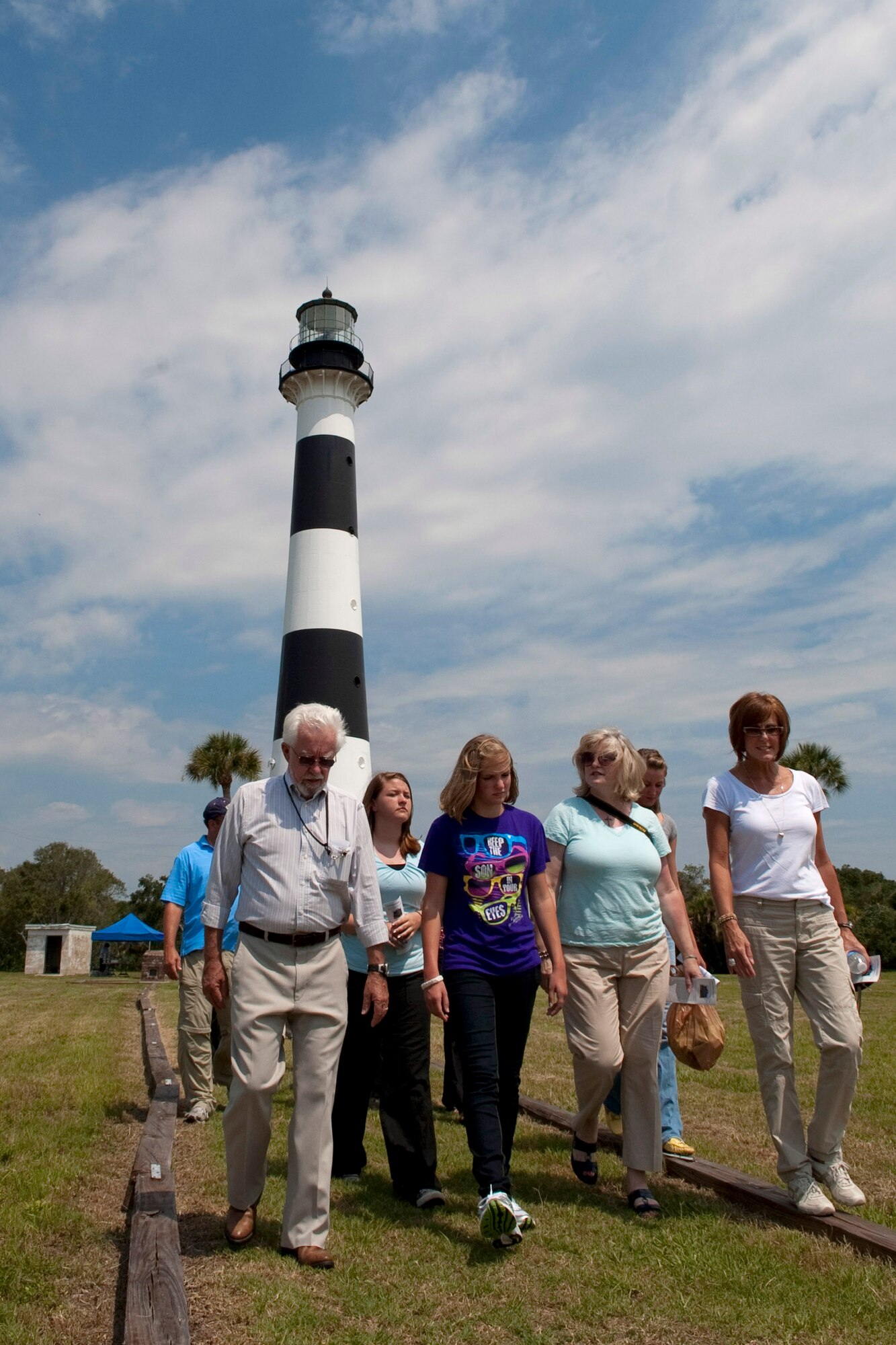 Sonny Witt, Detachment 1, 45th Mission Support Group director of operations, at left, gives a tour of Cape Canaveral Air Force Station to a group of visitors, including Lisa Wilson, wife of 45th Space Wing Commander Brig. Gen. Ed Wilson, at right, at the Cape Canaveral Lighthouse, one of several stops on the public tour of Cape Canaveral
AFS, offered Wednesdays and Thursdays. For tour details, call 321-494-5945 or email ccafstours@patrick.af.mil. (Air Force photo/Matthew Jurgens)