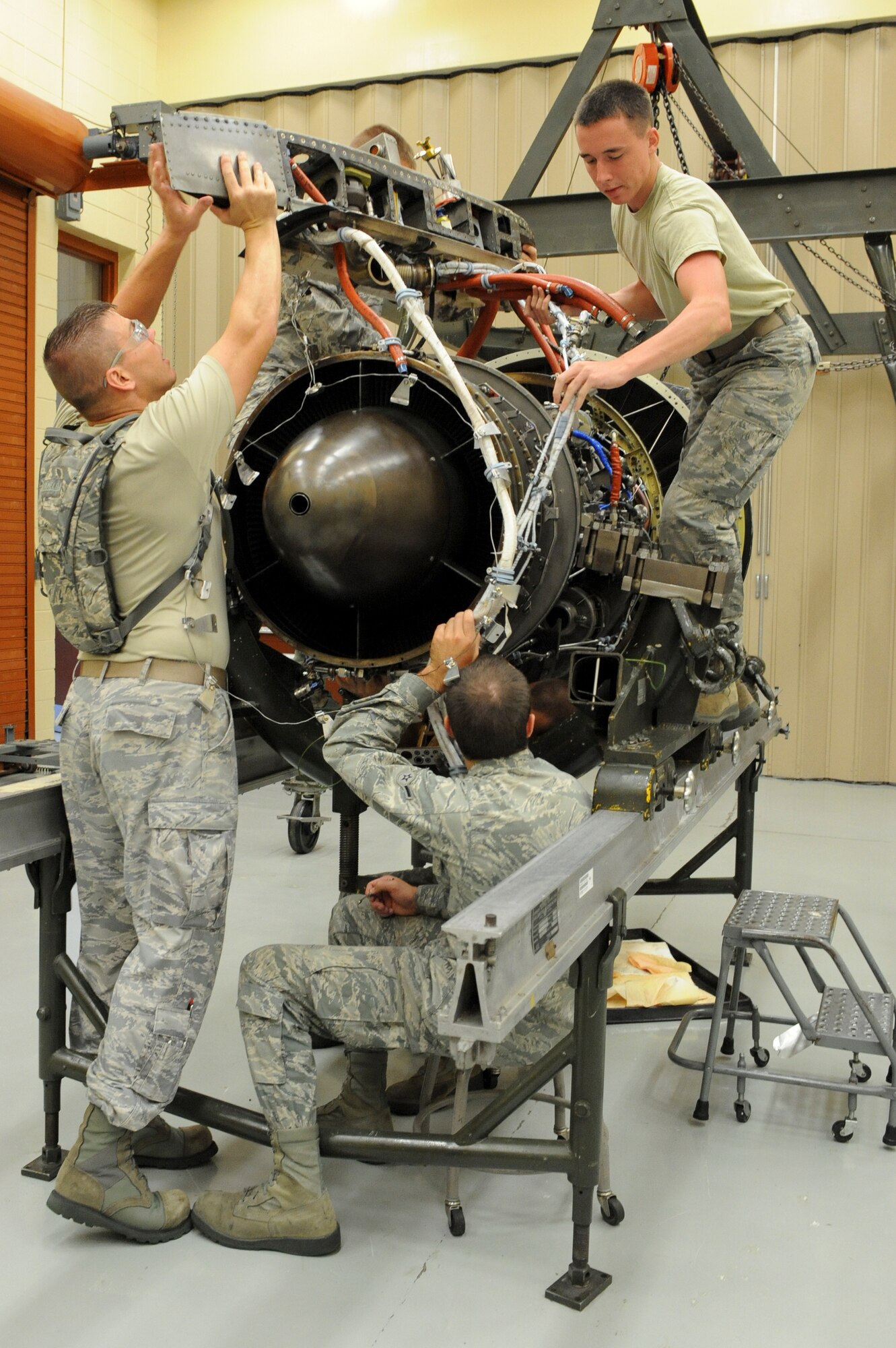 Students in the TF-34 Intermediate Maintenance Course, rebuild a TF-34 A-10 engine at the 372nd Training Squadron on Moody Air Force Base, Ga., Aug. 23, 2011. The course teaches students how to properly disassemble and reassemble the engine used in an A-10C Thunderbolt II. (U.S. Air Force photo by Joshua J. Garcia/Released)