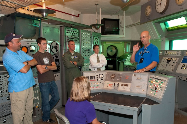 Jim Hale, a volunteer with the Air Force Space and Missile Museum at Cape Canaveral Air Force Station, explains rocket launch procedures to a tour group, which included Brig. Gen. Ed Wilson, 45th Space wing commander. The museum is one of many stops on the new public tour of CCAFS, offered on Wednesdays and Thursdays. For details about the public tour program, call 494-5945 or e-mail ccafstours@patrick.af.mil. (Air Force Photo/Matthew Jurgens)