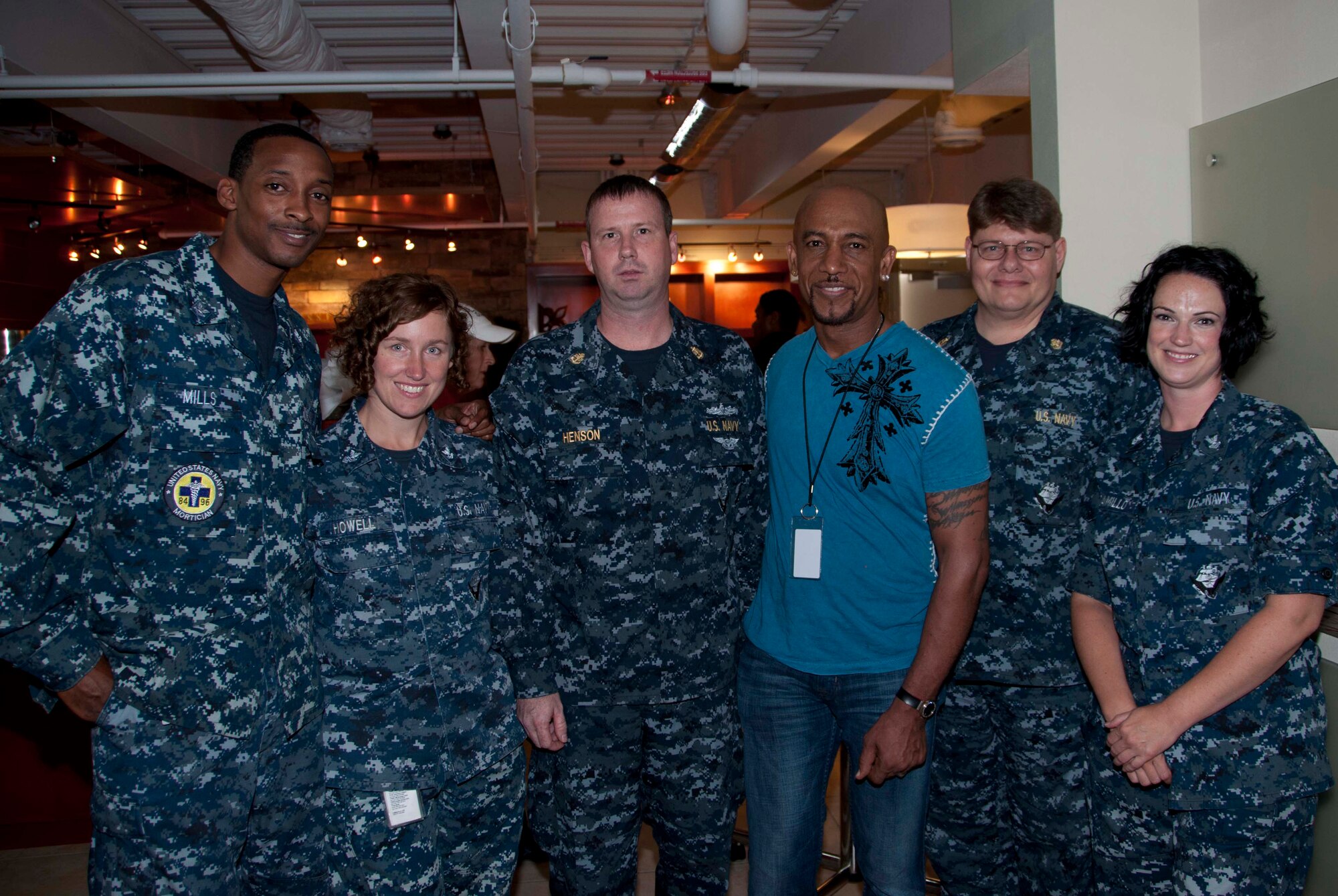 The Navy Liaison Team poses with actor and veteran Montel Williams at the Charles C. Carson Center for Mortuary Affairs Aug. 25, 2011. Montel served in the Marine Corps and U.S. Navy. He hosted a luncheon for the men and women who support the sacred mission of honoring fallen servicemembers. (U.S. Air Force photo/Tech. Sgt. Marvin Moore)