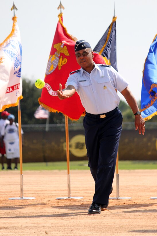 Maj. Gen. Garry Dean, Air Forces Northern commander, tosses out the ceremonial first pitch during opening ceremonies of the 2011 U.S. Specialty Sports Association Military World Tournament at Frank Brown Park, Panama City Beach, Aug. 18, 2011. The event draws teams from across the Department of Defense and for the first time, drew an overseas team from Kunsan Air Base, Korea. (Photo by Nikki Hilbert)