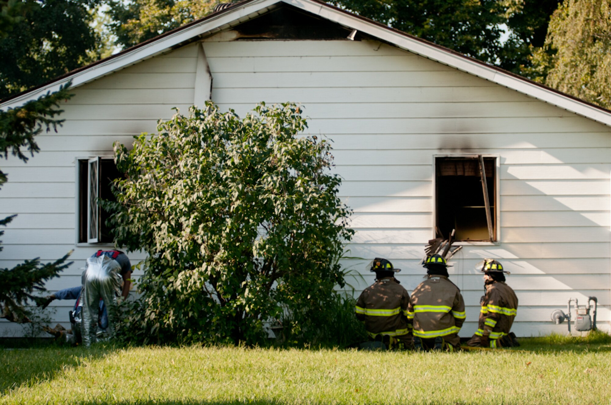 Airmen from the Missouri Air National Guard’s 139th Airlift Wing Fire Department respond to a house fire in Elwood, Ks., on August 25, 2011. The airmen were called to assist a mutual aid with the Doniphan County Volunteer Fire Department. (U.S. Air Force photo by Senior Airman Sheldon Thompson)